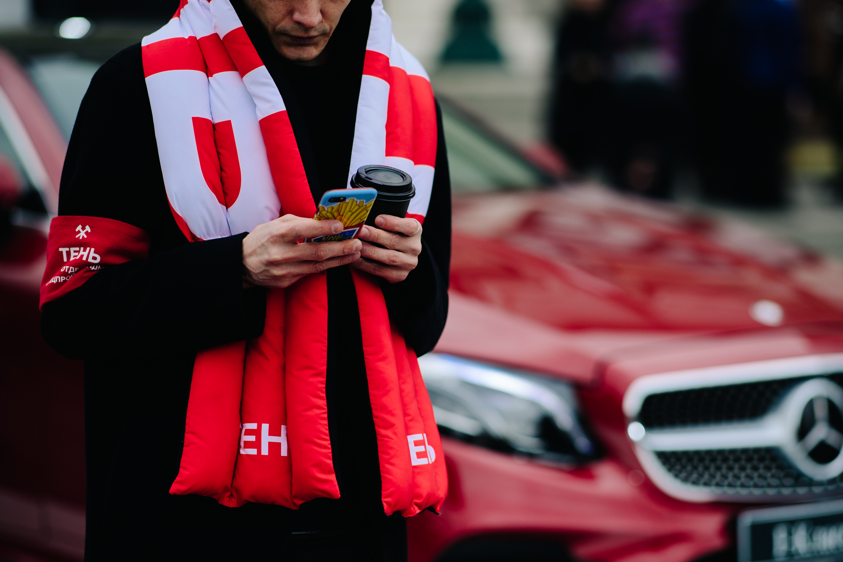 Man wearing red inflatable scarf
