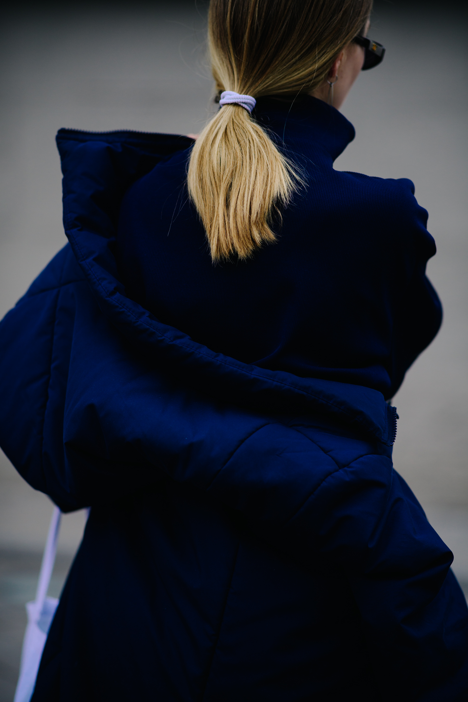 Girl wearing blue puffer jacket