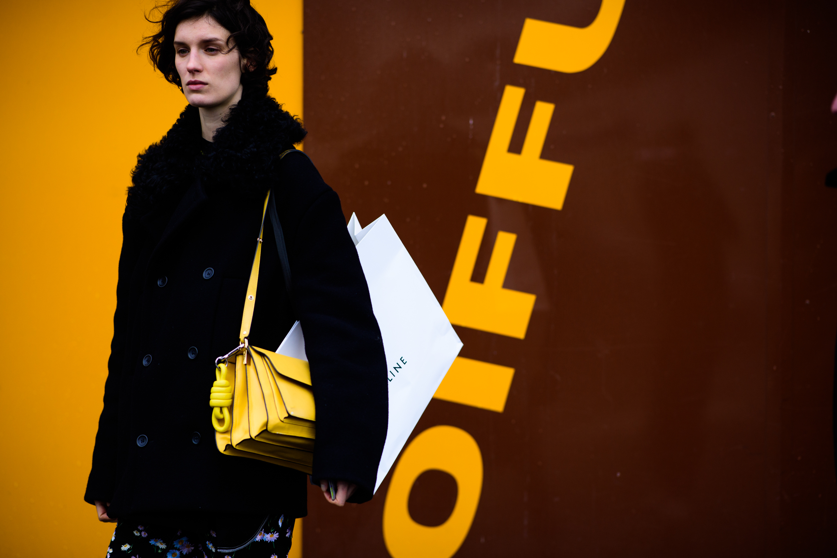 Model wearing yellow Loewe shoulder bag