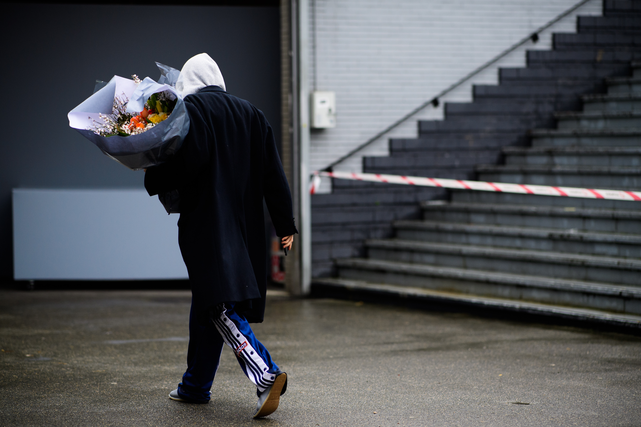 Woman wearing Adidas pants after Balenciaga