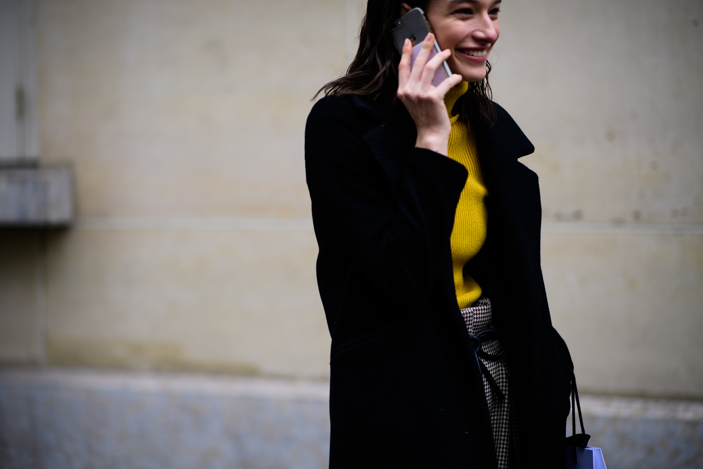 Model wearing yellow sweater after show