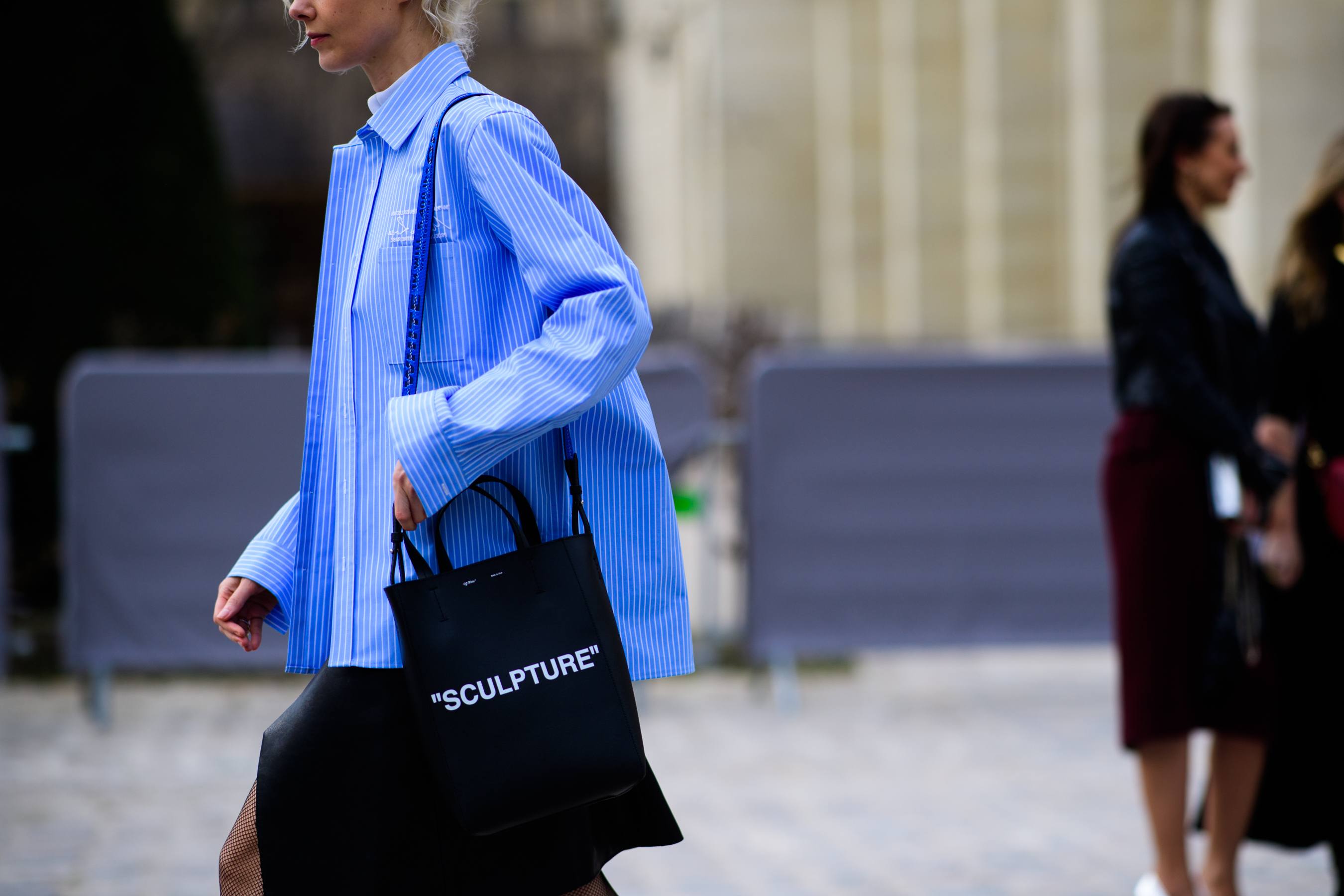 Russian buyer wearing blue oversized shirt