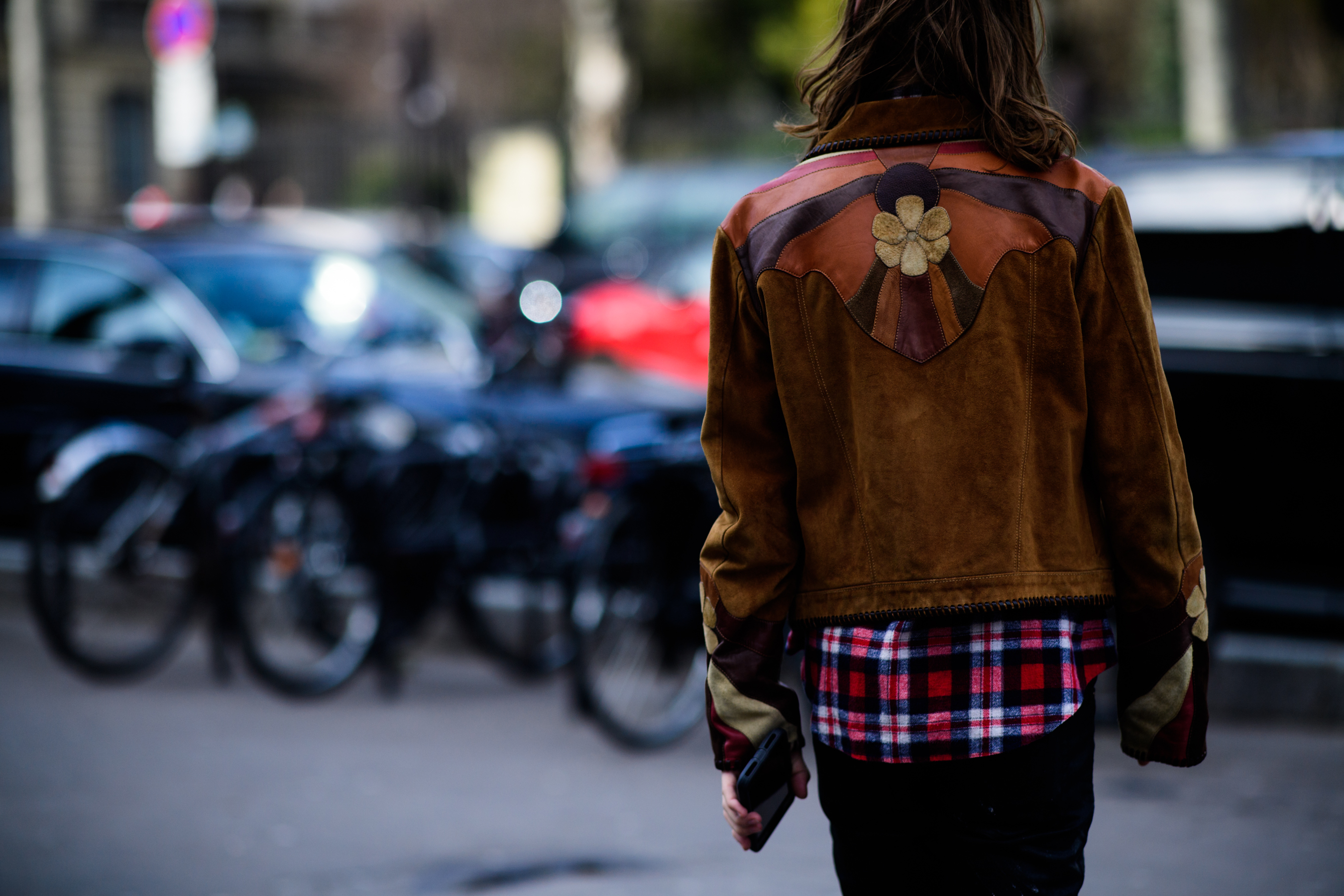 Woman wearing cowboy leather jacket