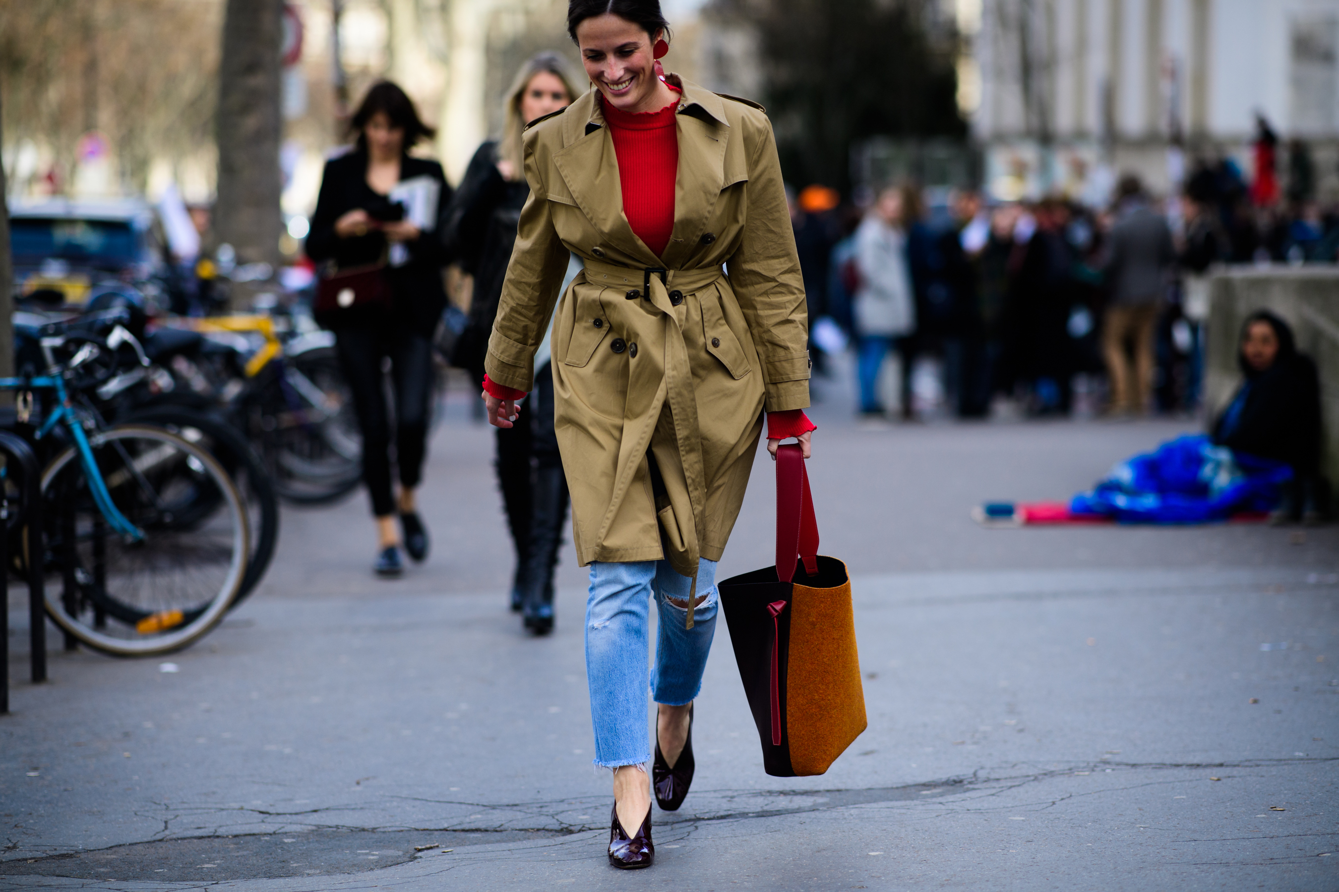 Woman wearing trench coat and Celine bag