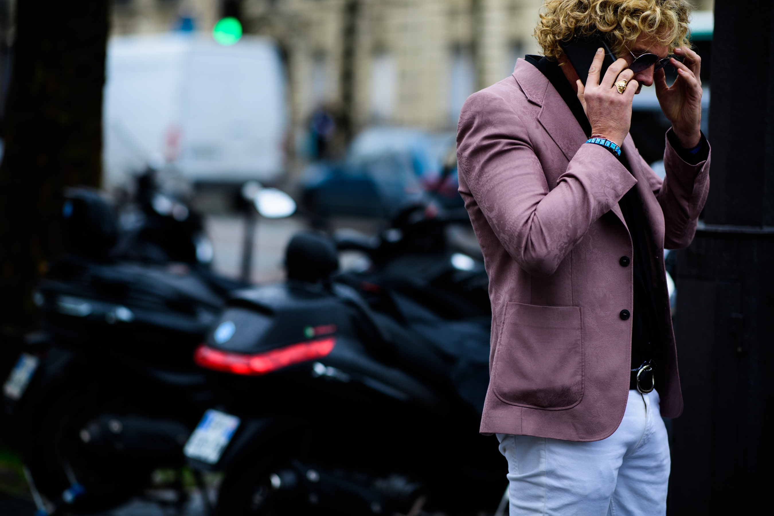 Designer wearing pink blazer