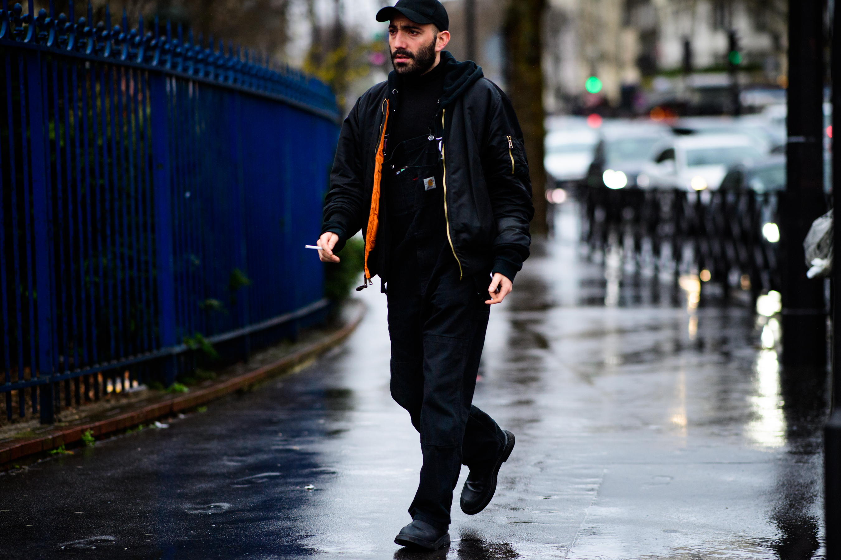 French photographer wearing black bomber