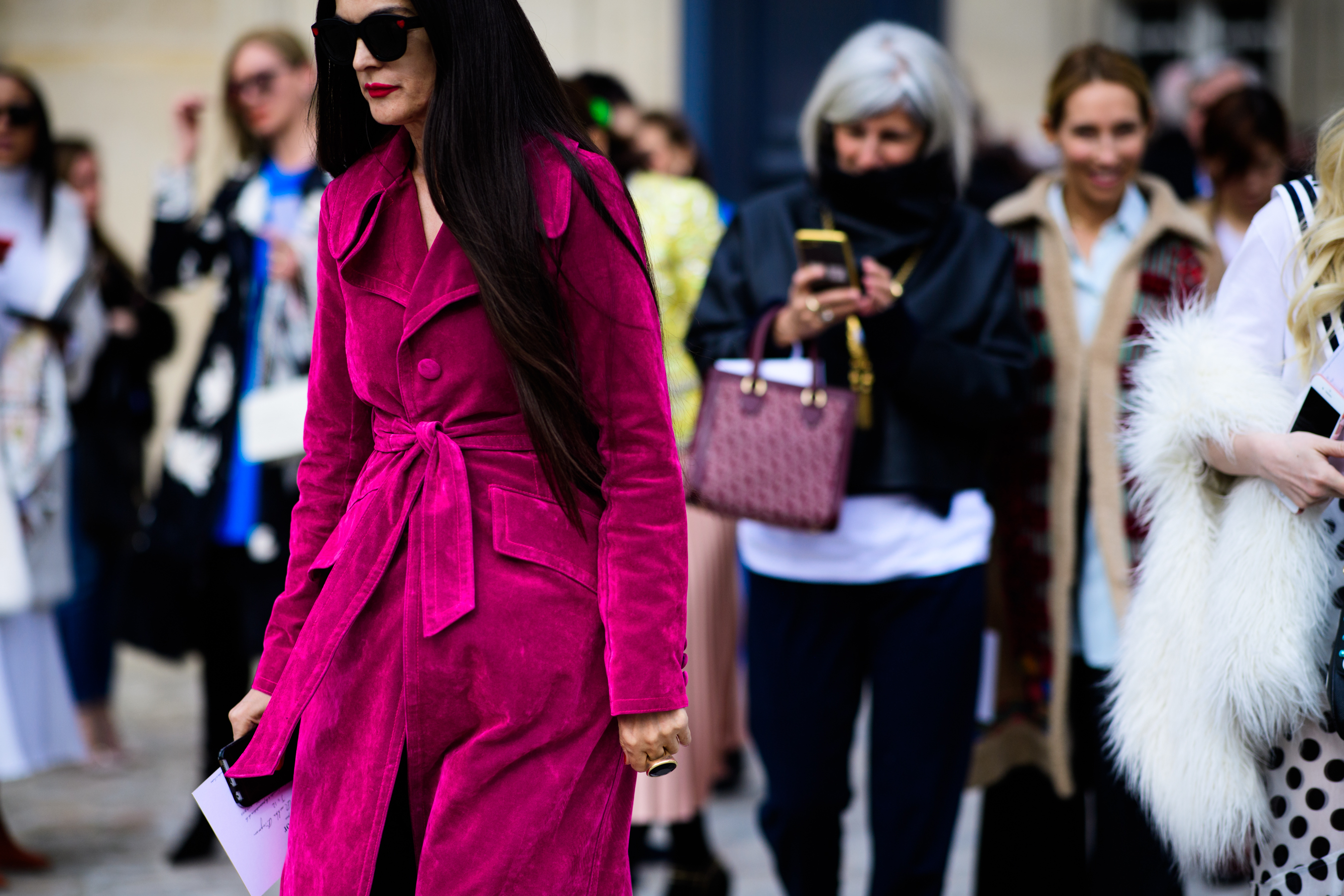 Woman wearing pink coat before Dior