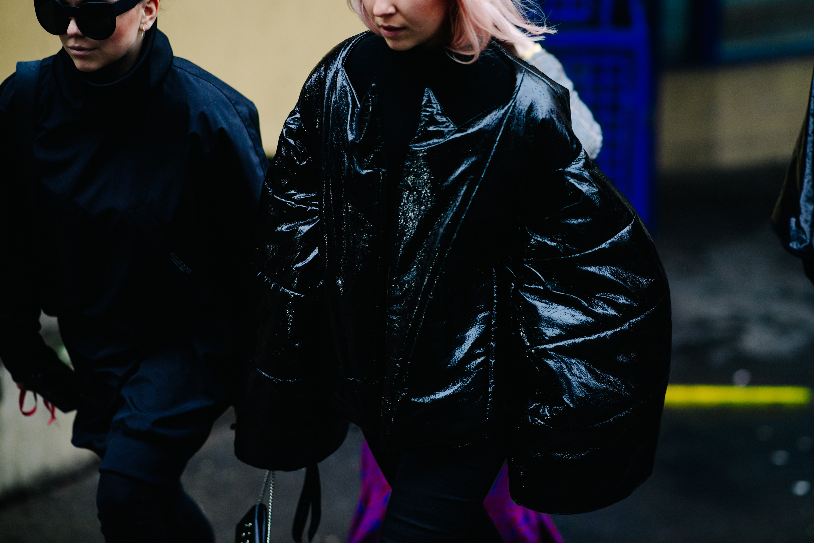 Woman wearing oversized black coat
