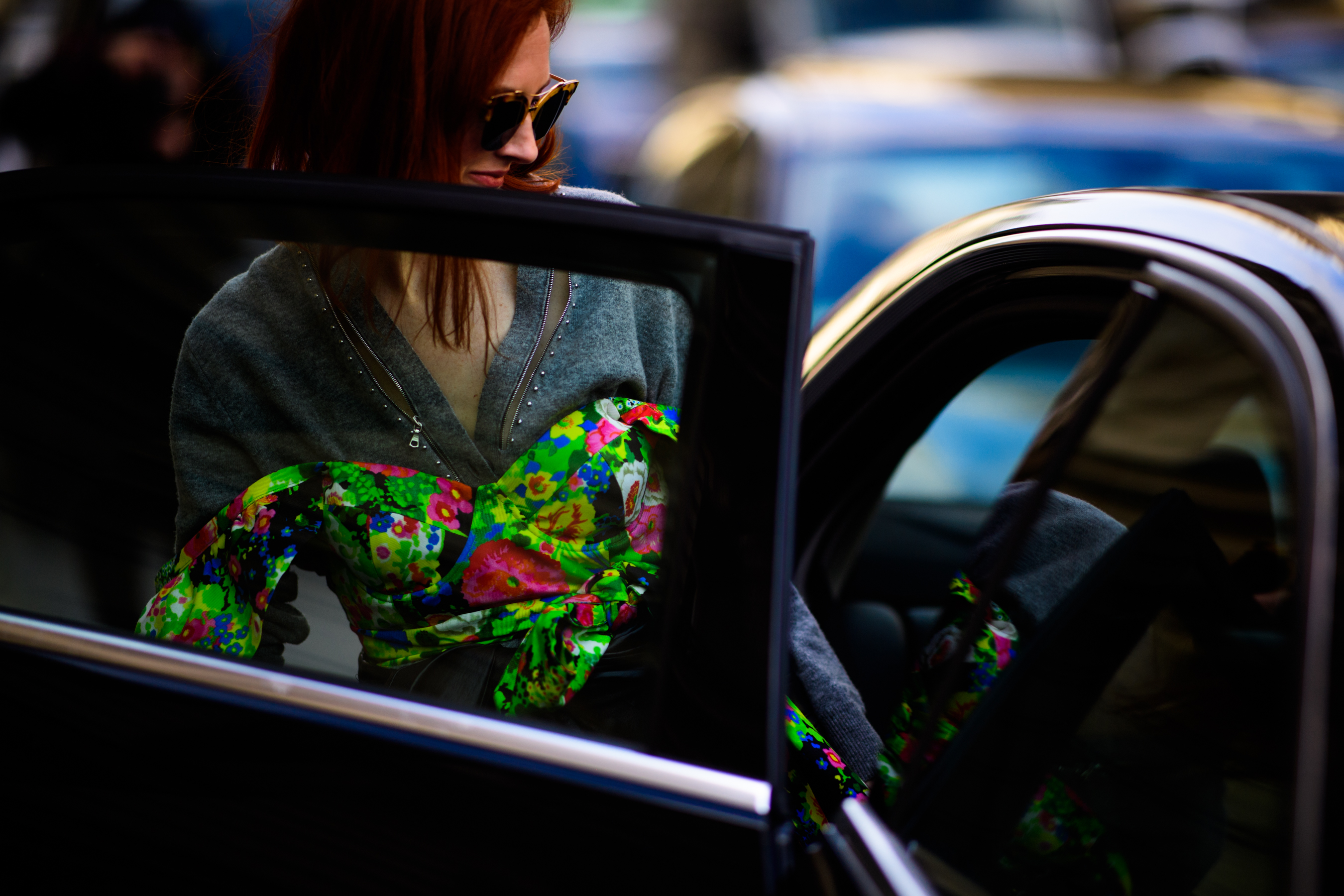 Woman wearing top over sweater