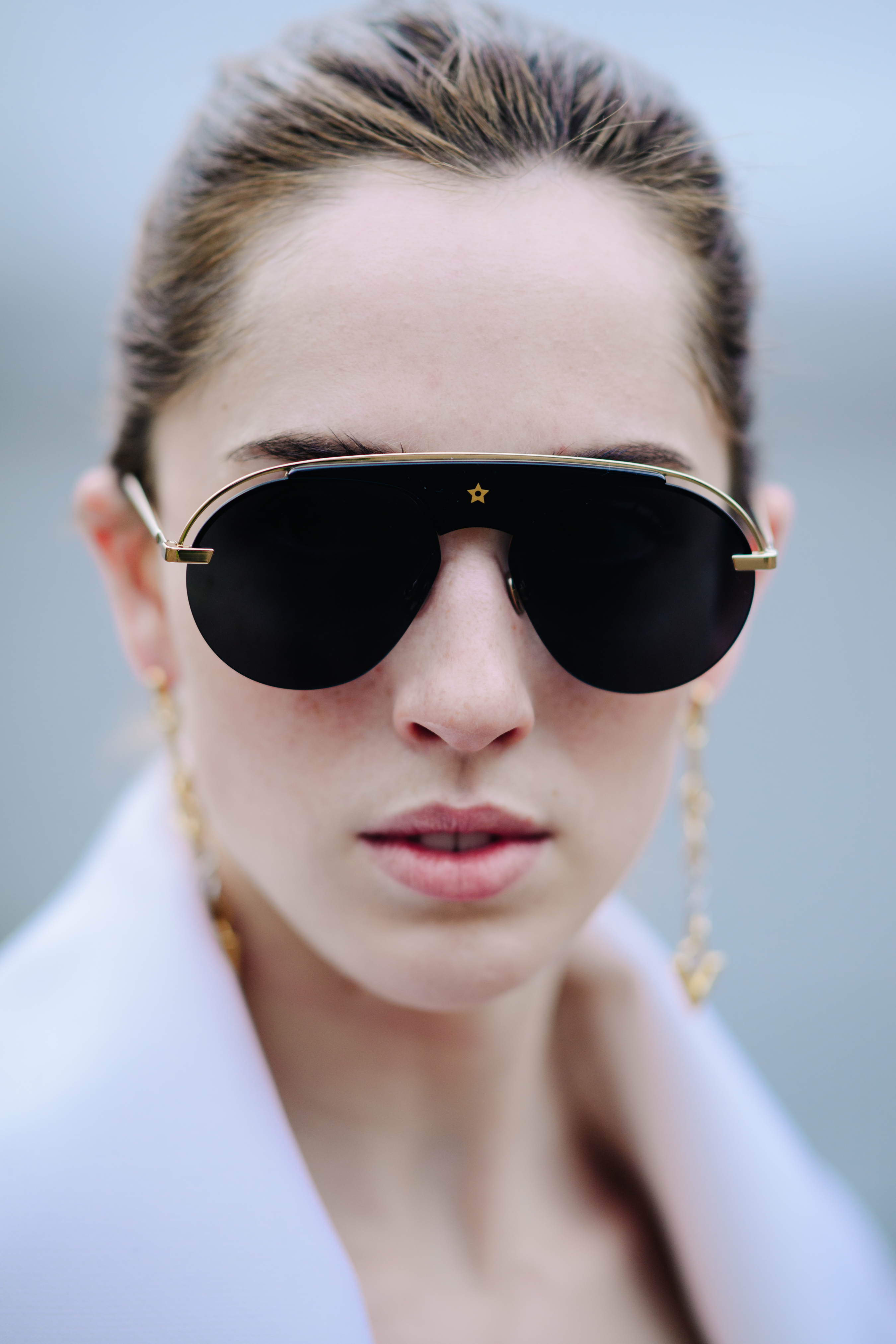 Portrait of a model wearing Dior glasses