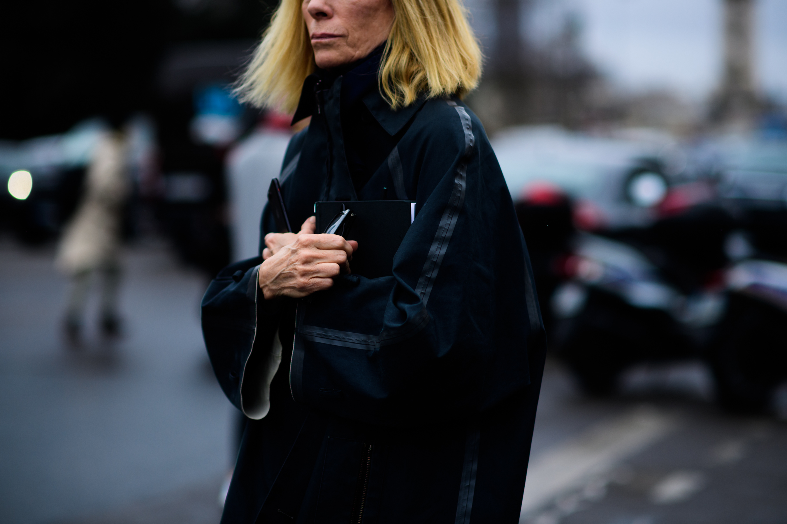 American journalist wearing black coat