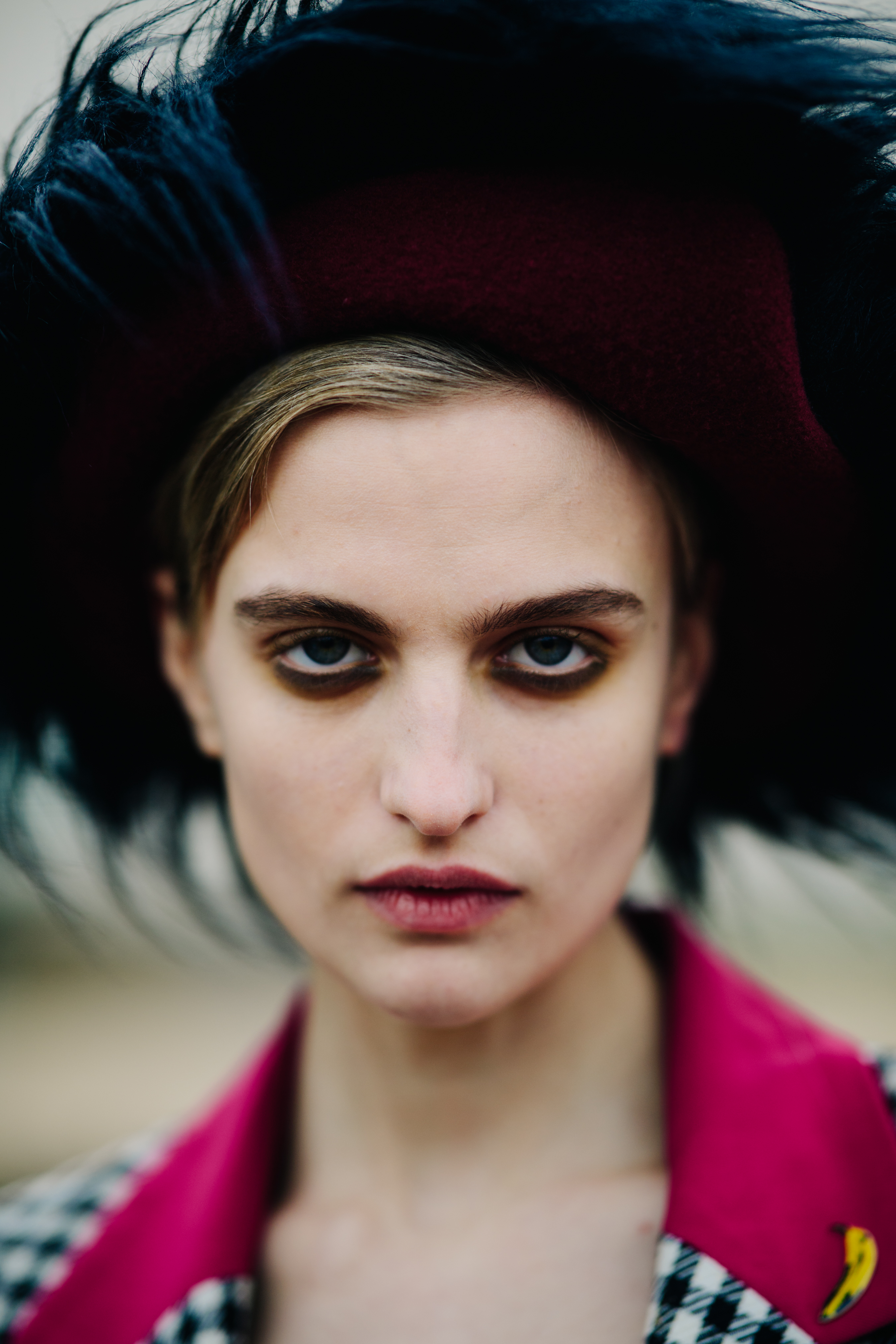 Model wearing red hat