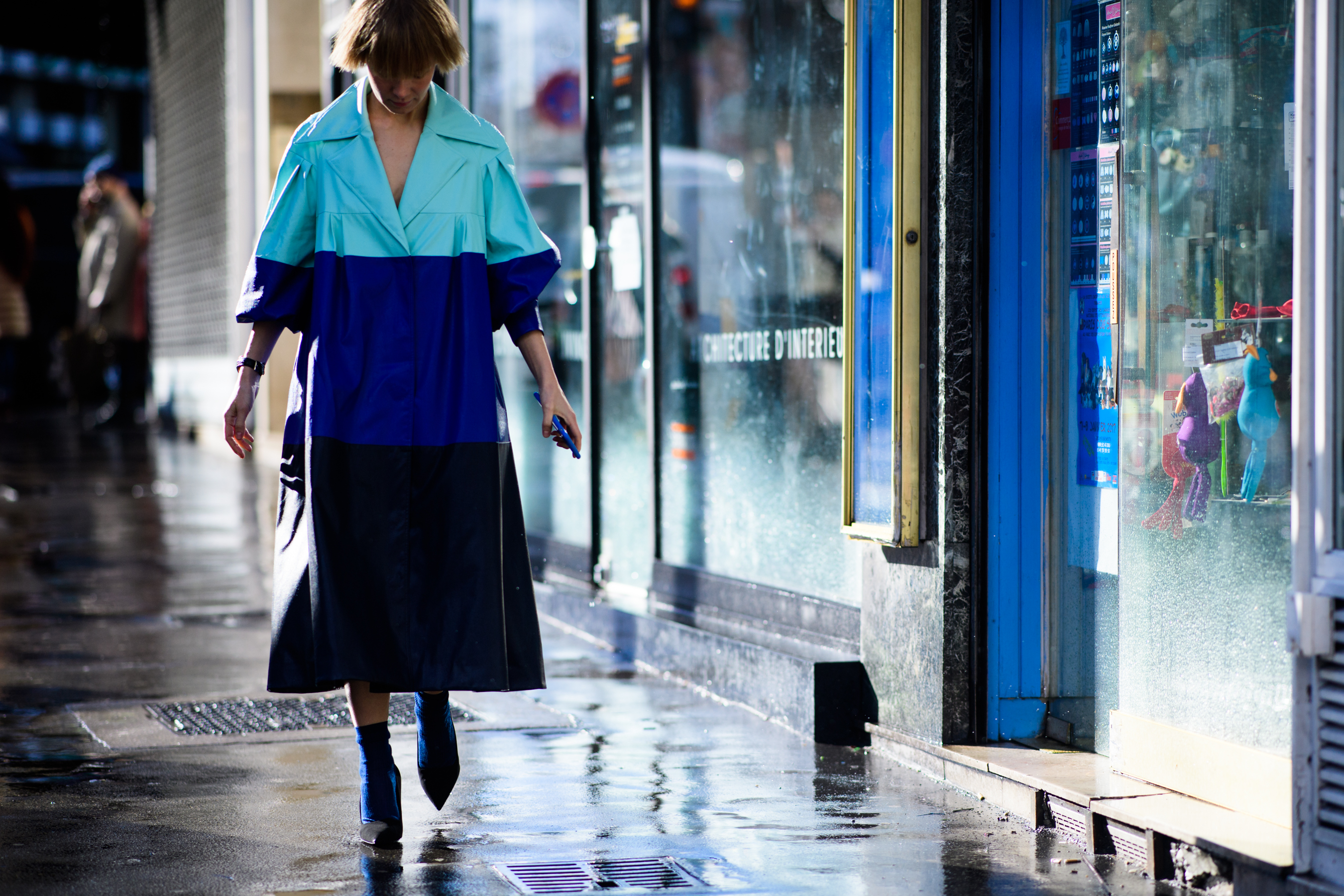 Russian designer wearing blue coat