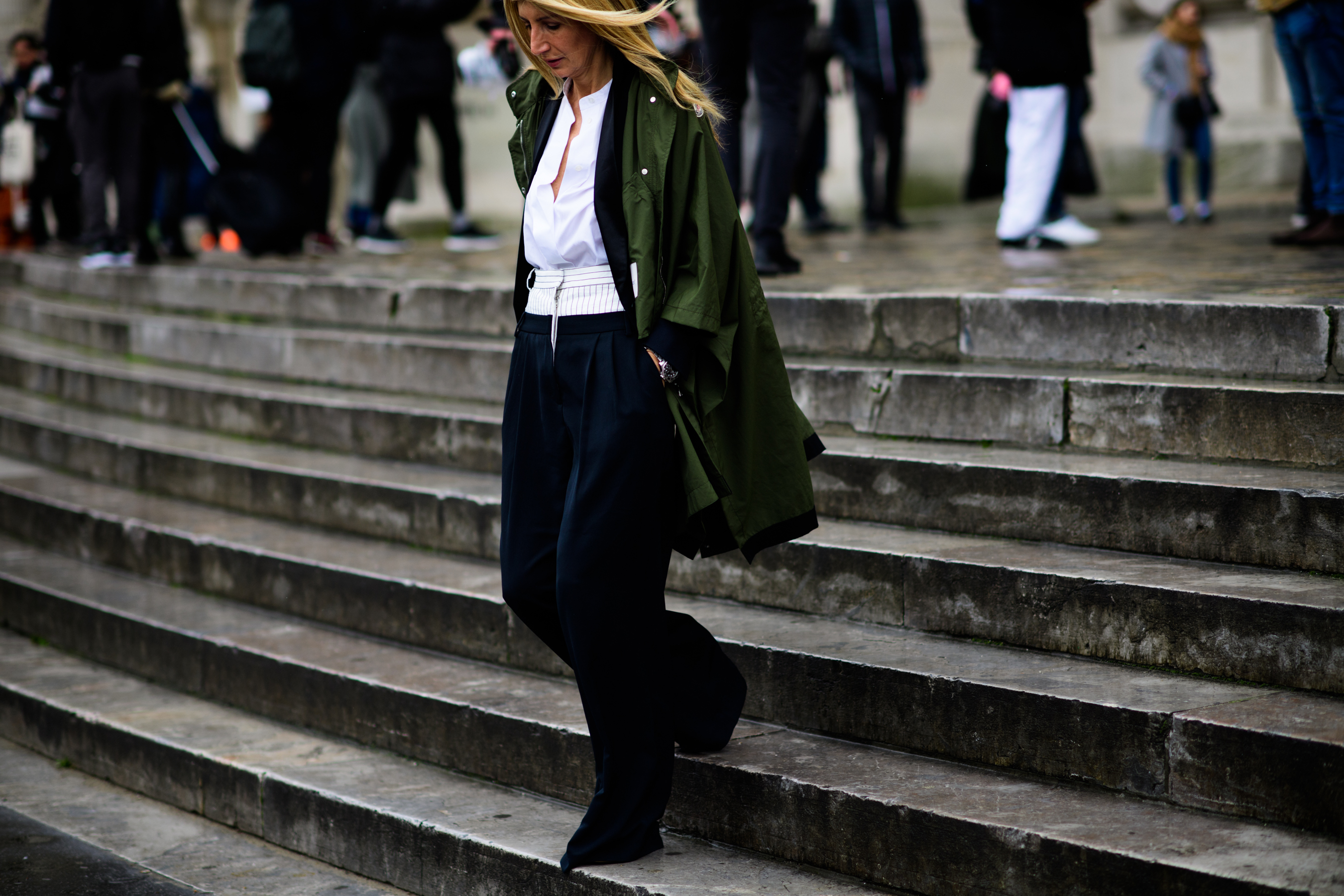 American journalist wearing green parka