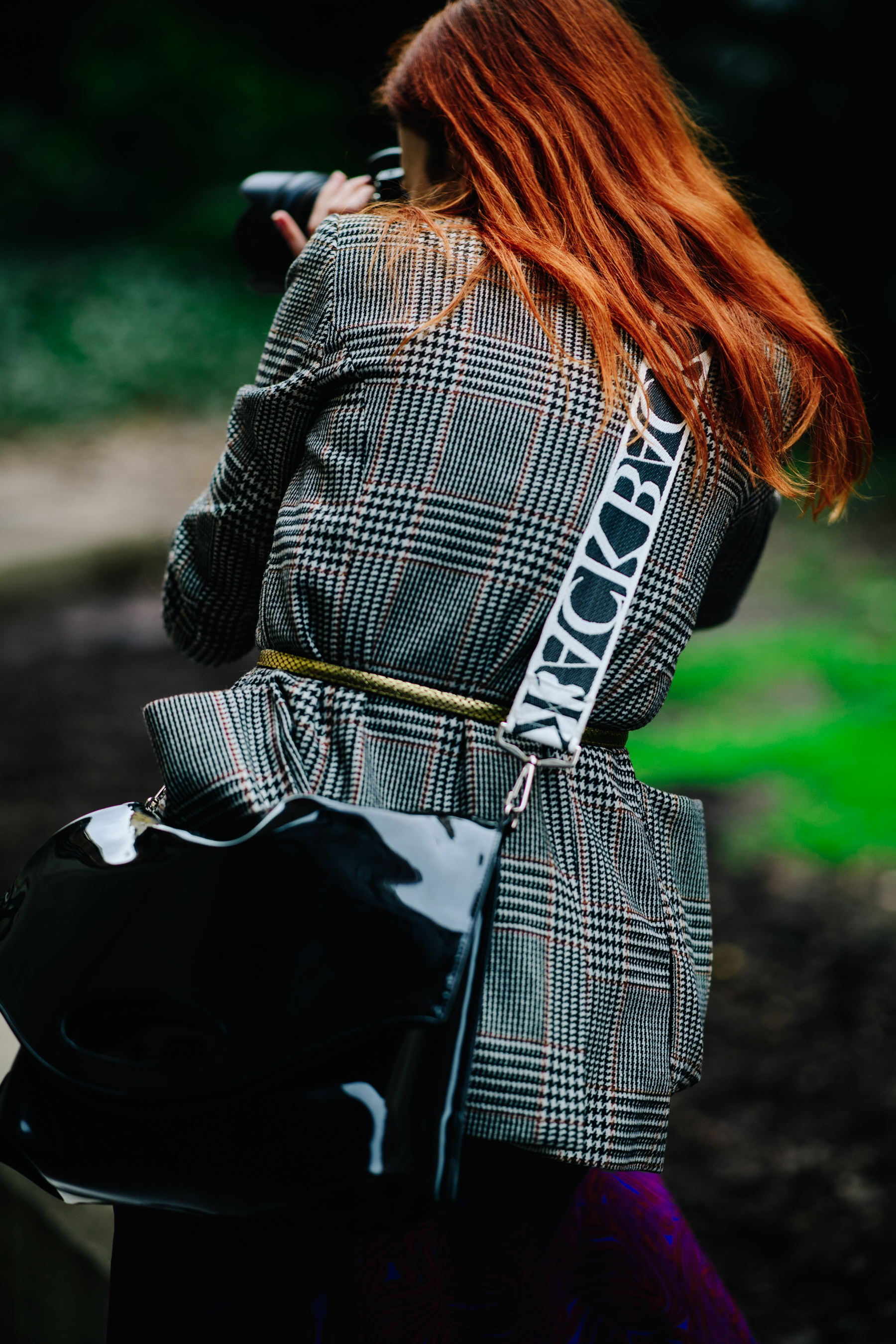 Photographer wearing belted blazer