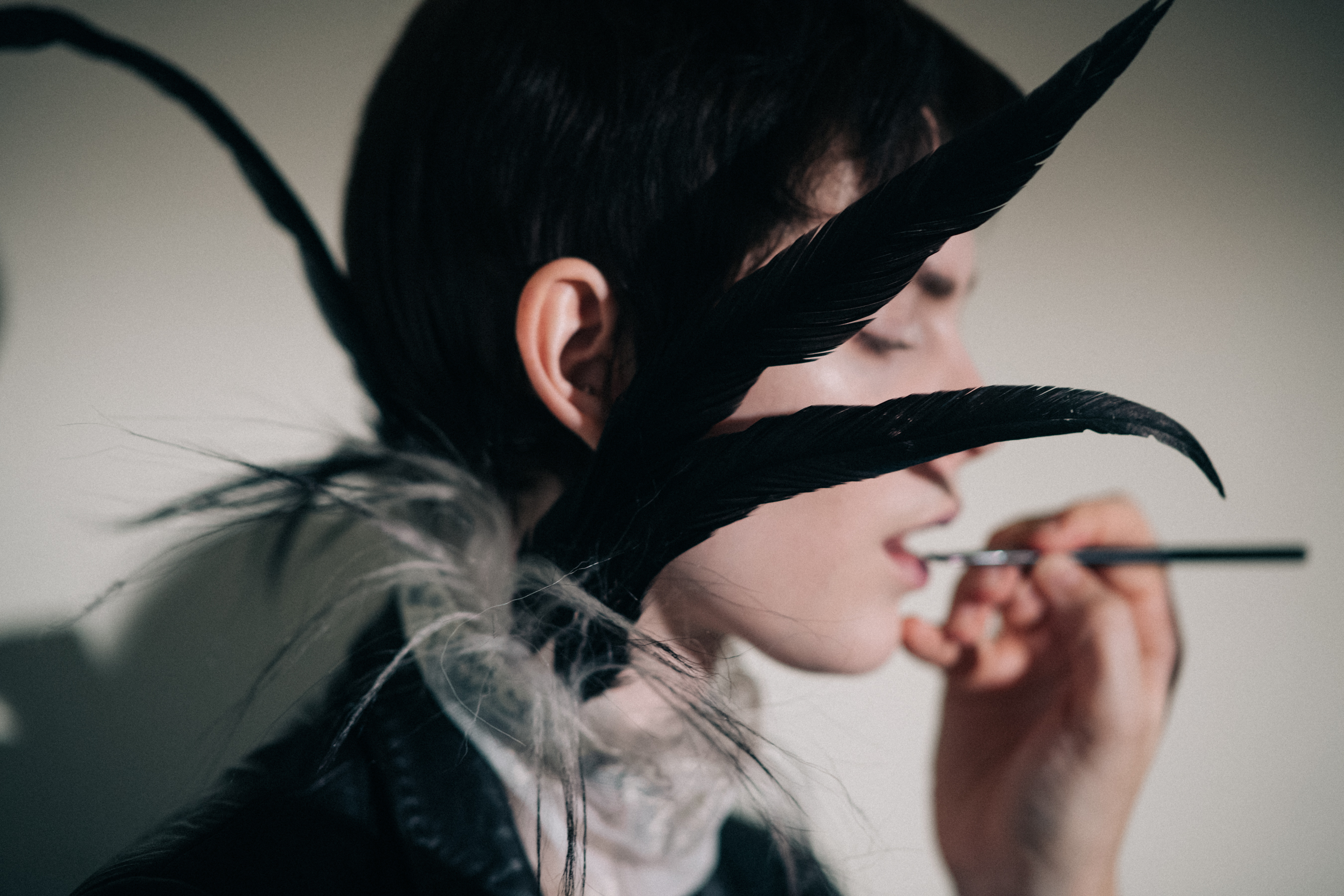 Amandine Renard wearing feathers