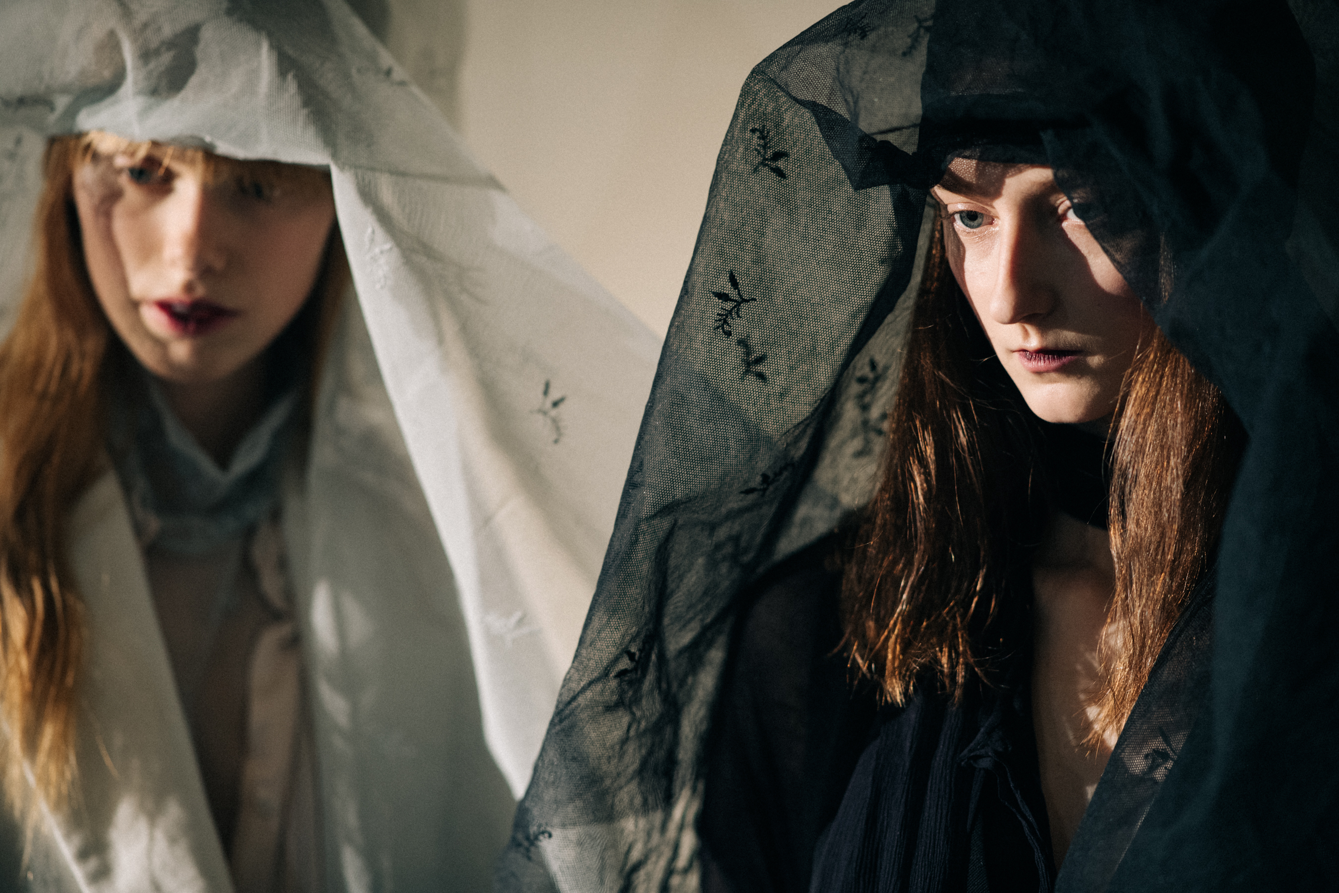 Two models wearing veils