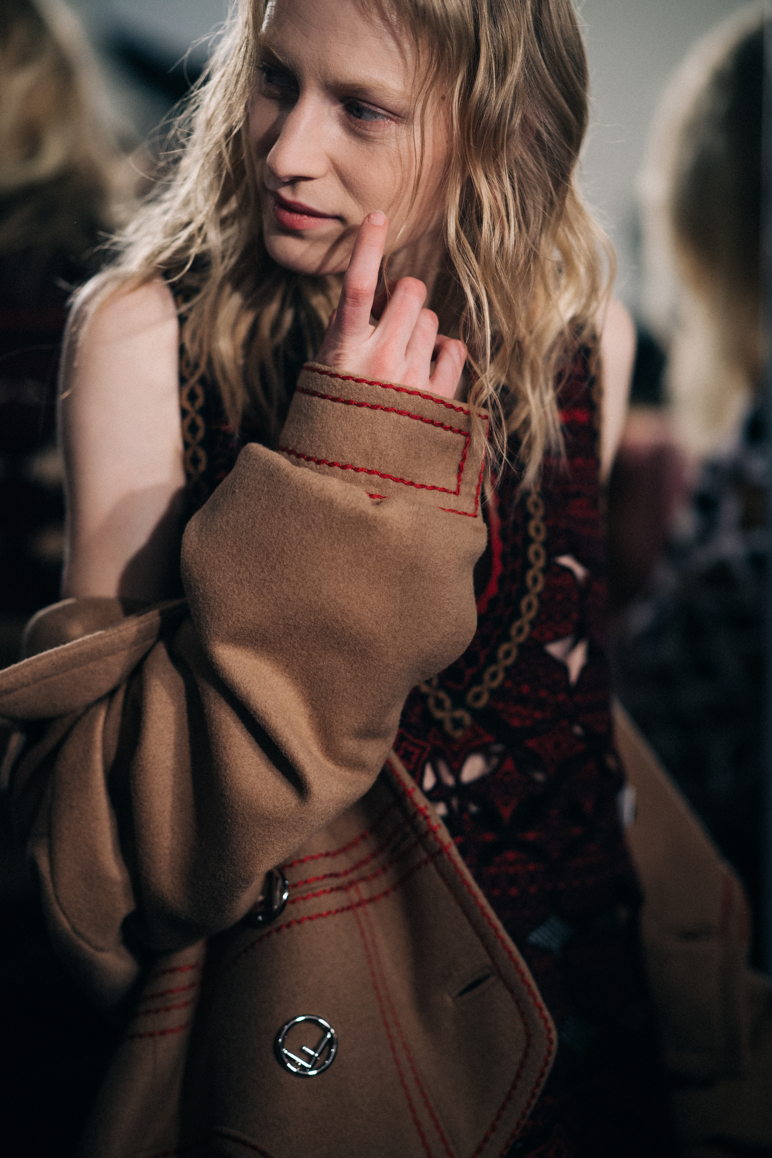 Model wearing brown coat