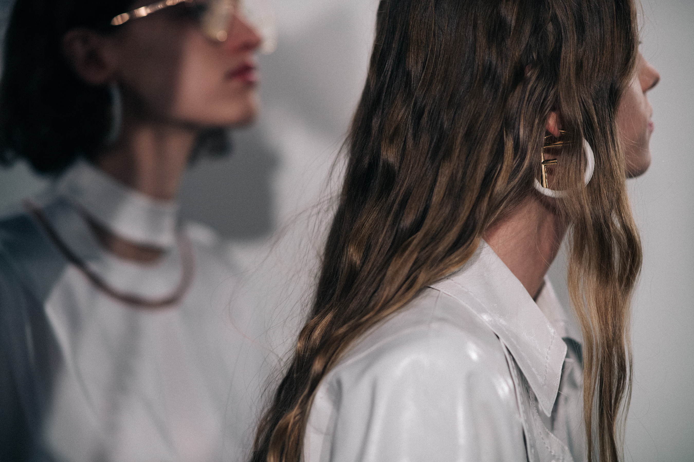 Two models wearing white