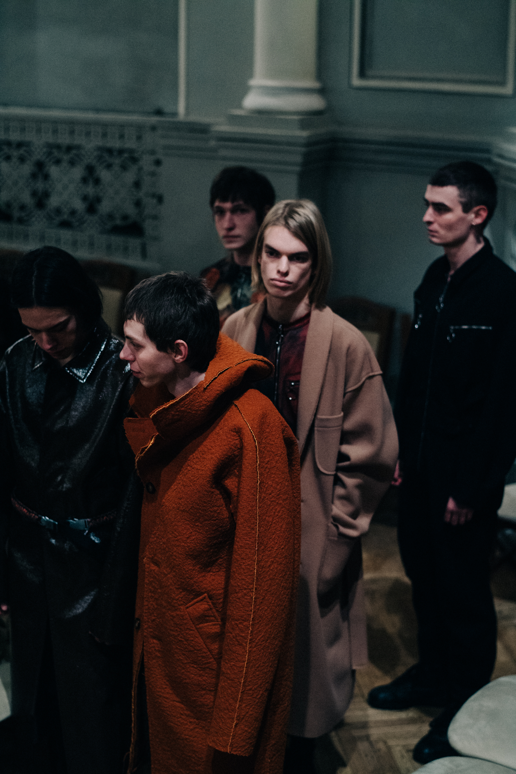 Group of male models before a show