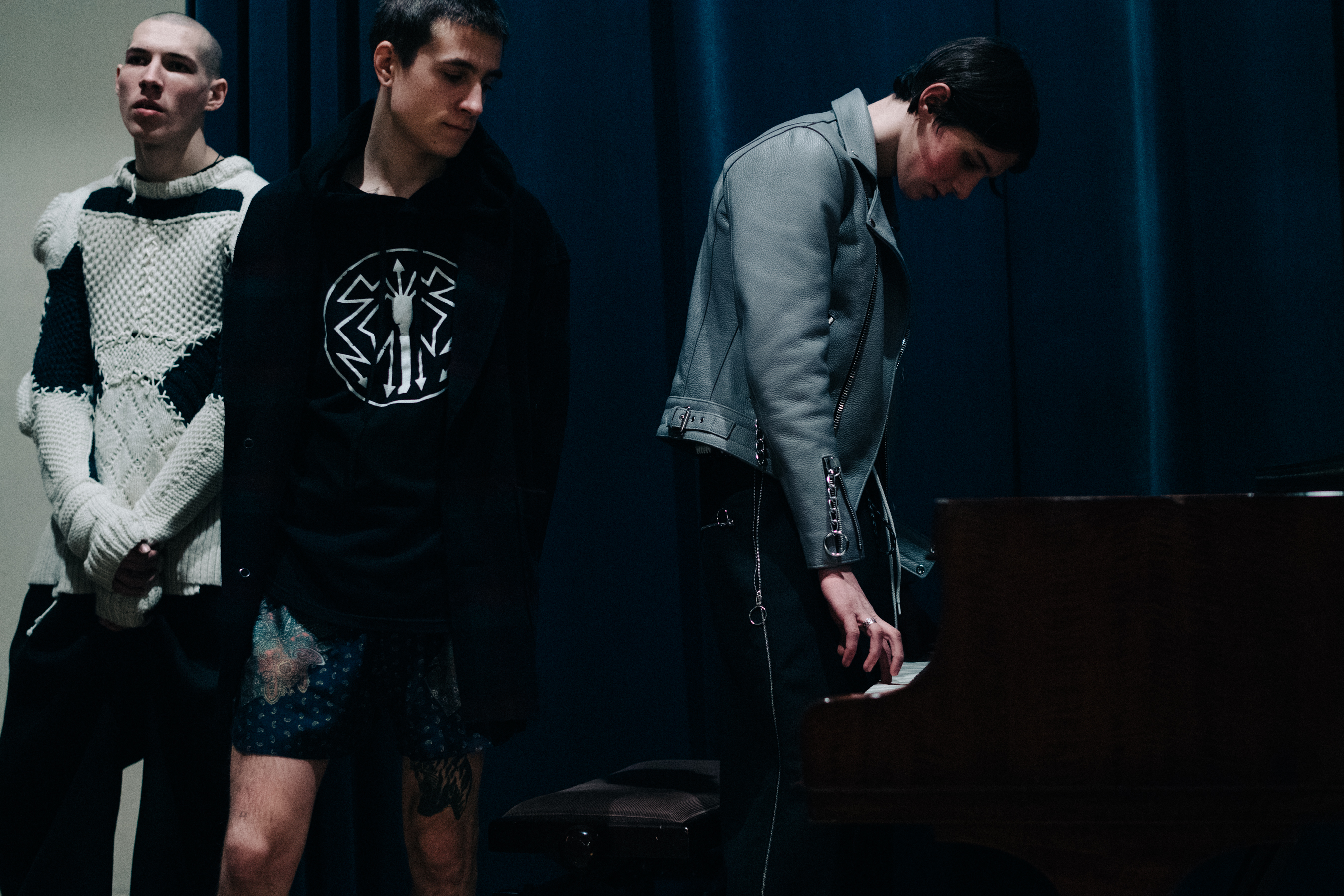 Group of male models before a show