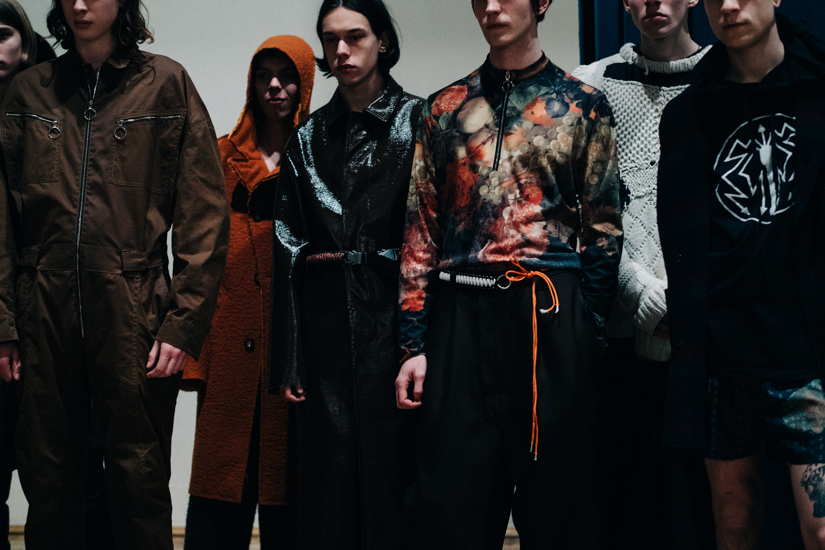 Group of male models before a show