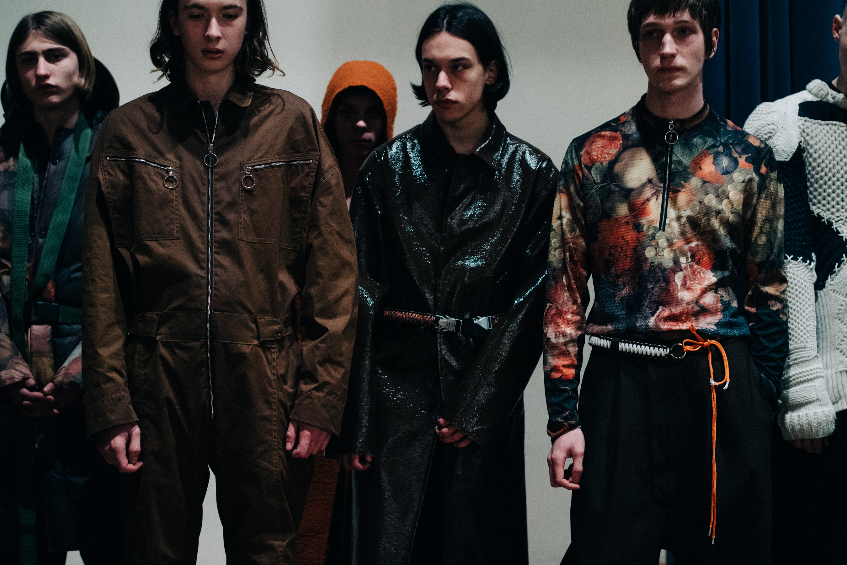 Group of male models before a show