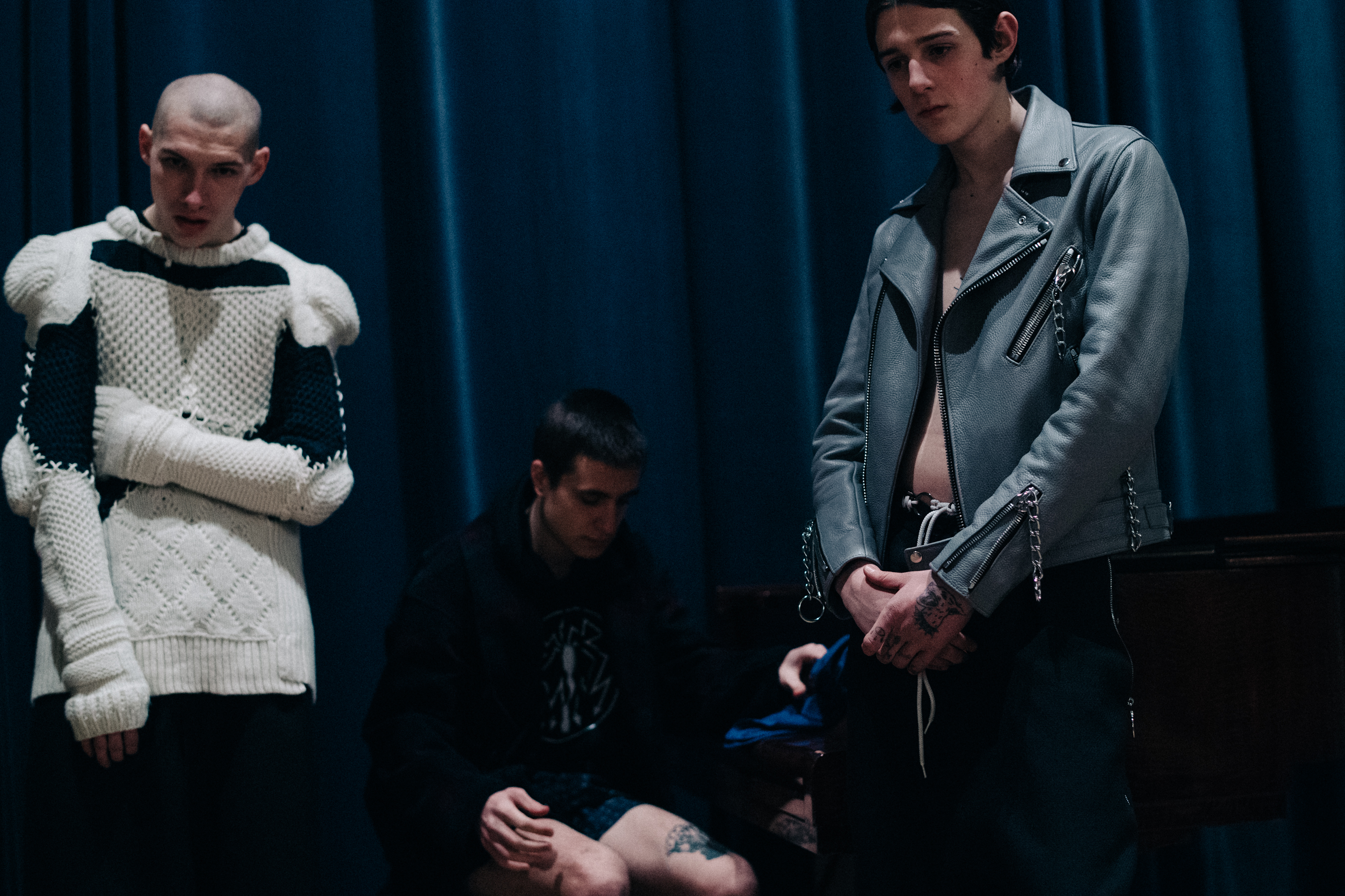 Group of male models before a show