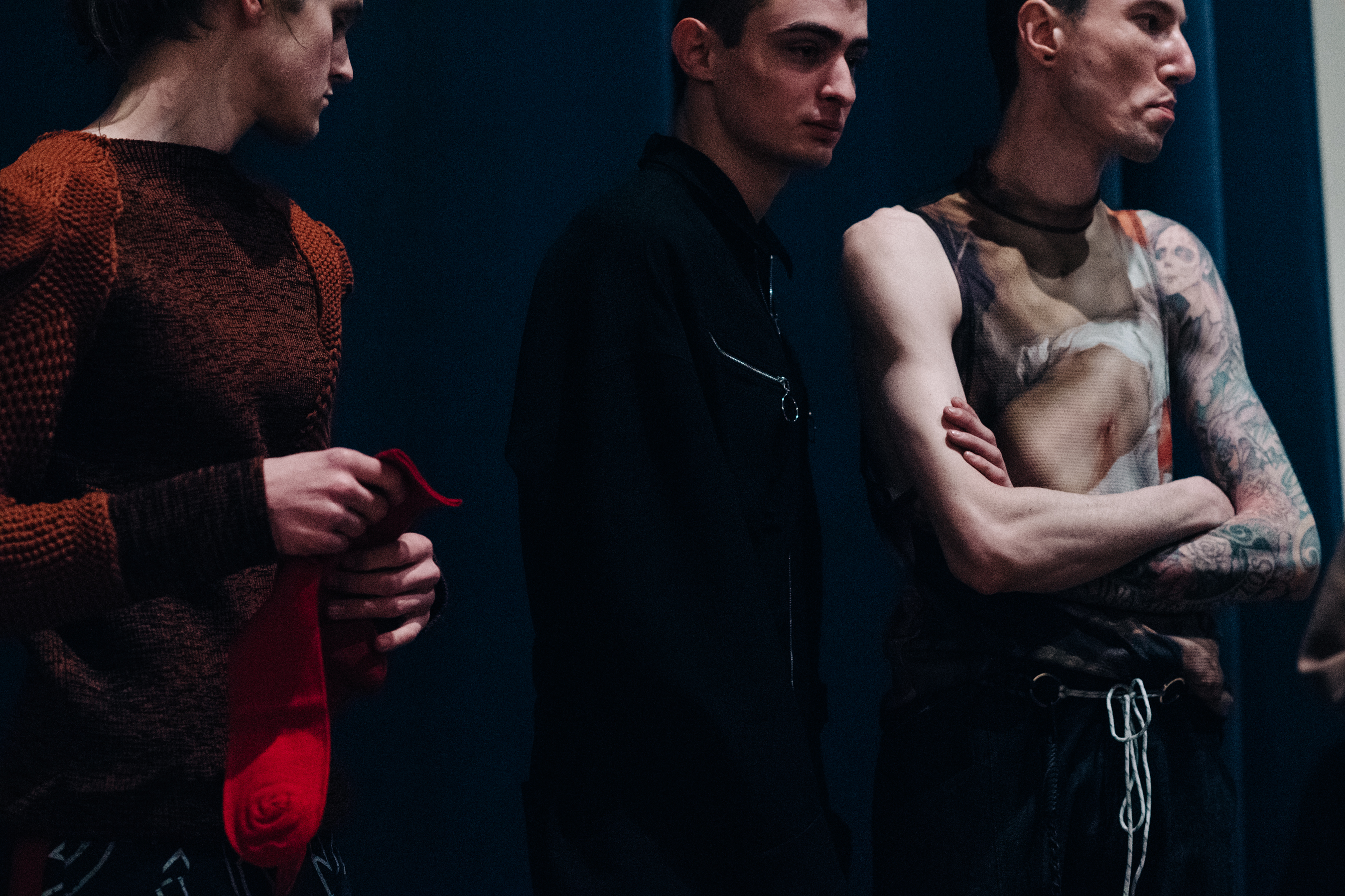 Group of male models before a show