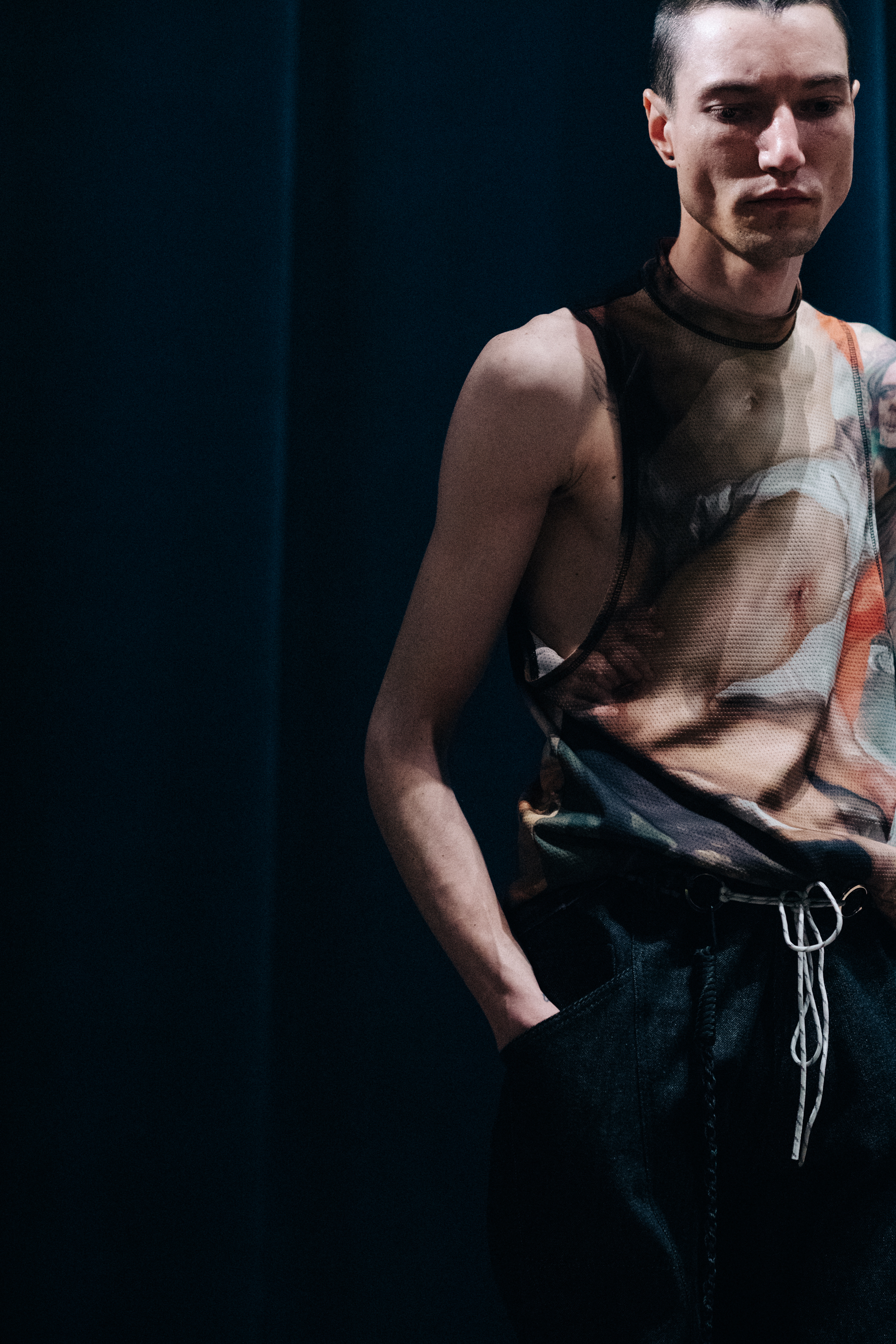 Male model wearing transparent shirt