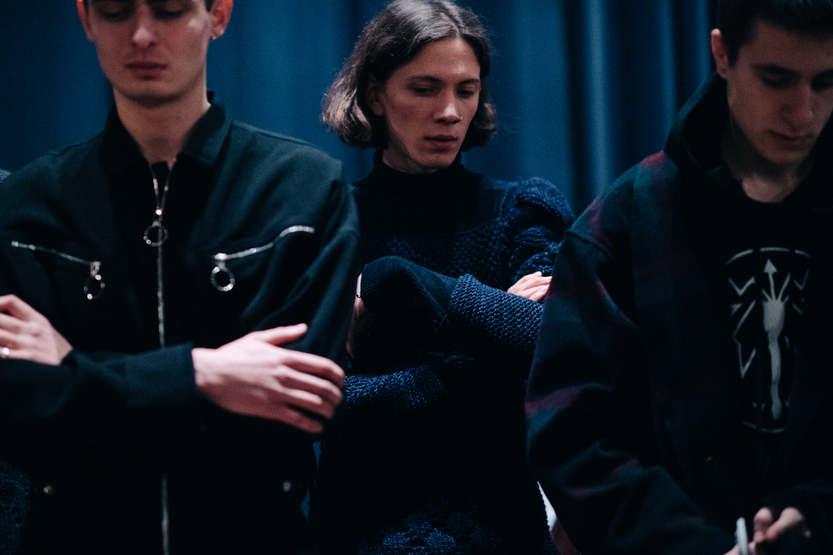 Group of male models wearing dark