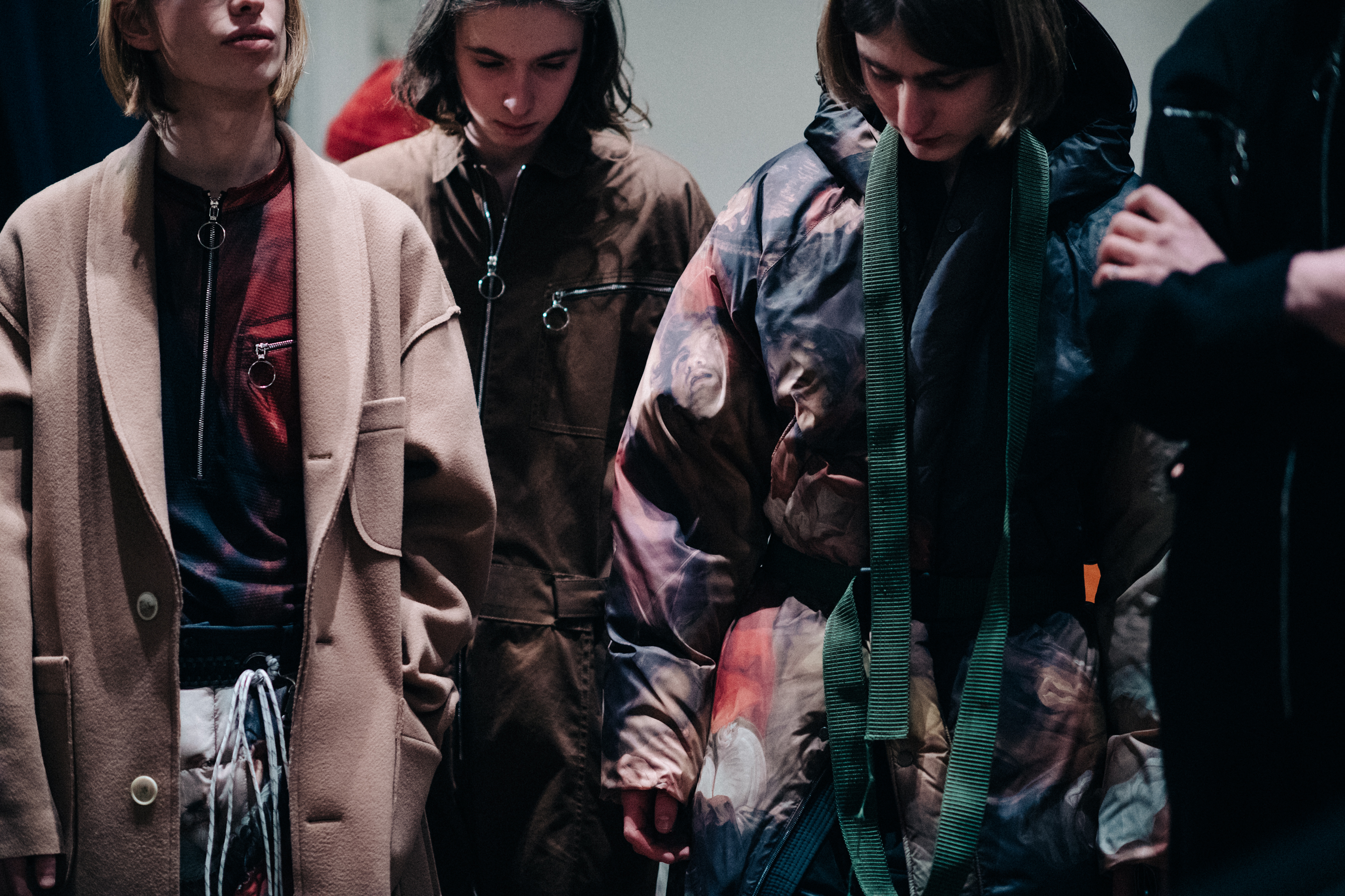 Group of male models before a show
