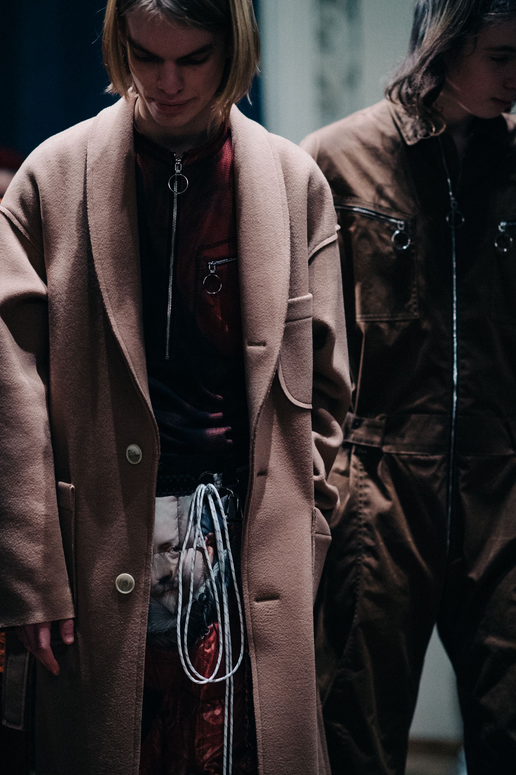 Male model wearing beige coat