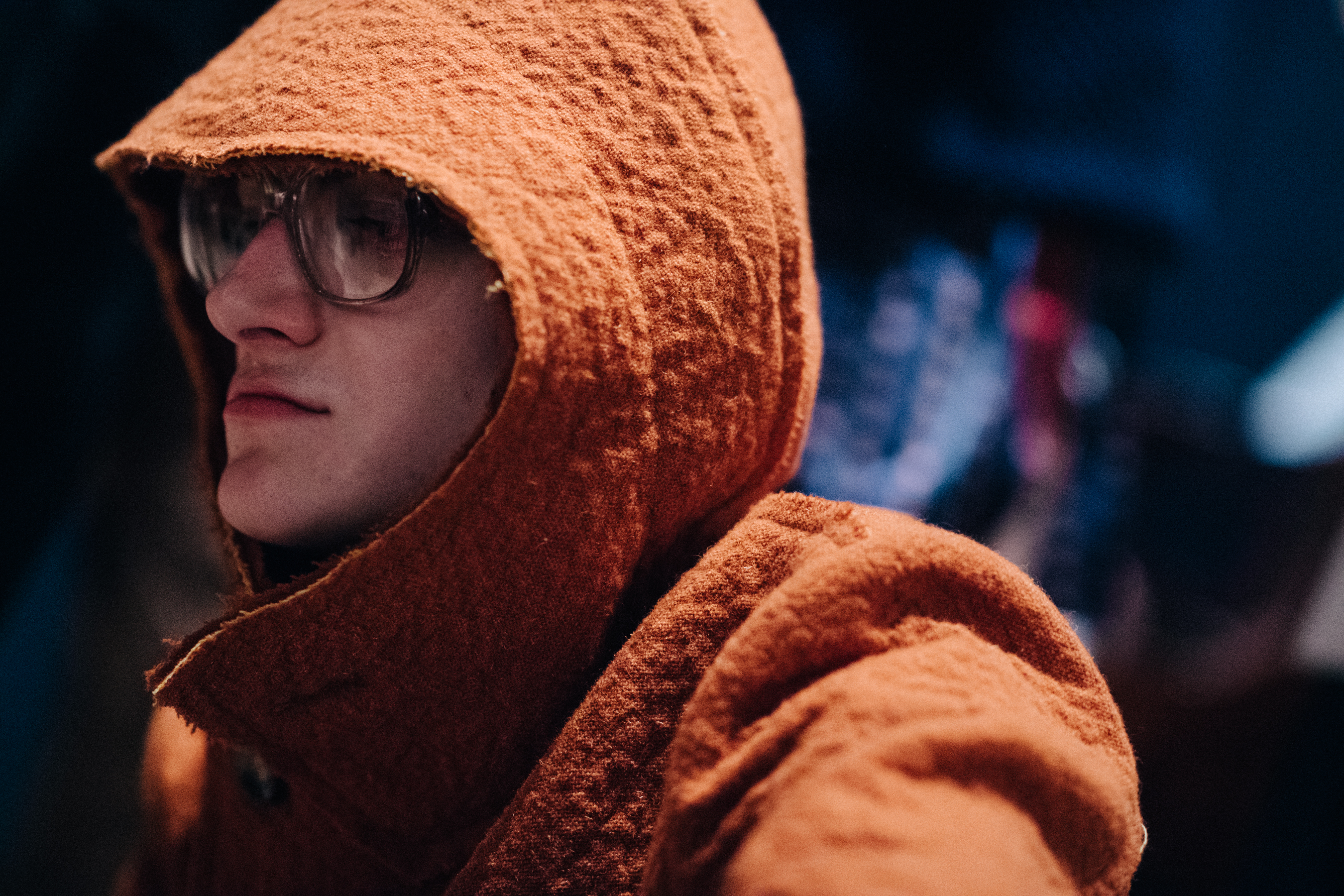 Male model wearing orange coat