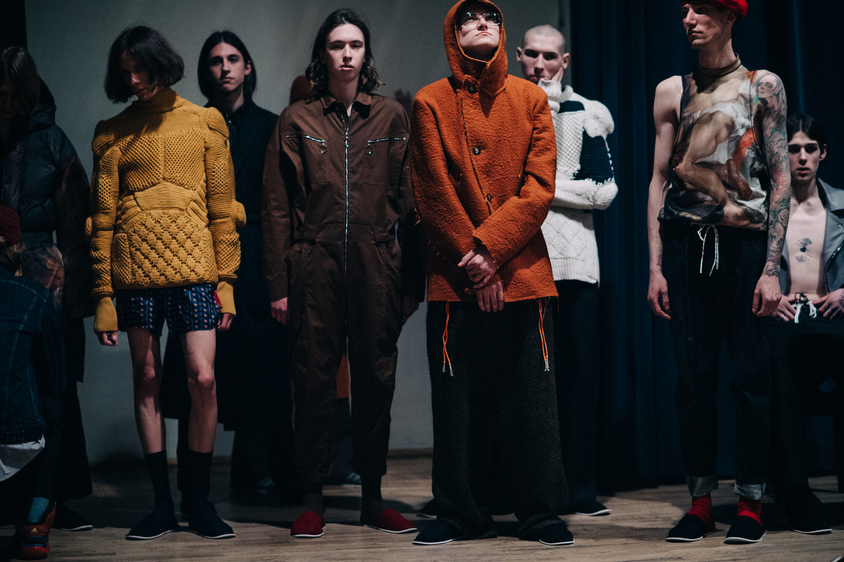 Group of male models before a show