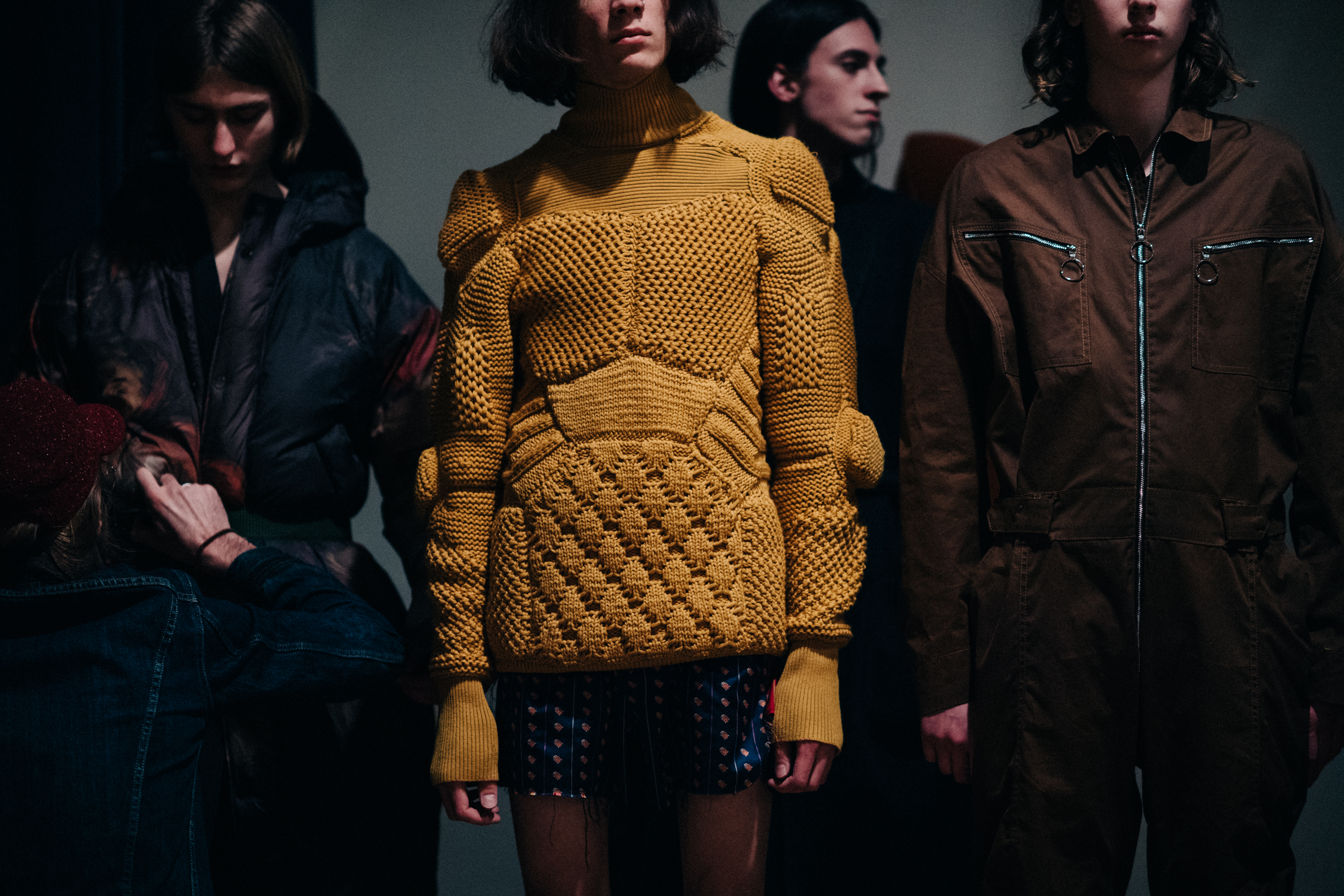 Male model wearing yellow sweater
