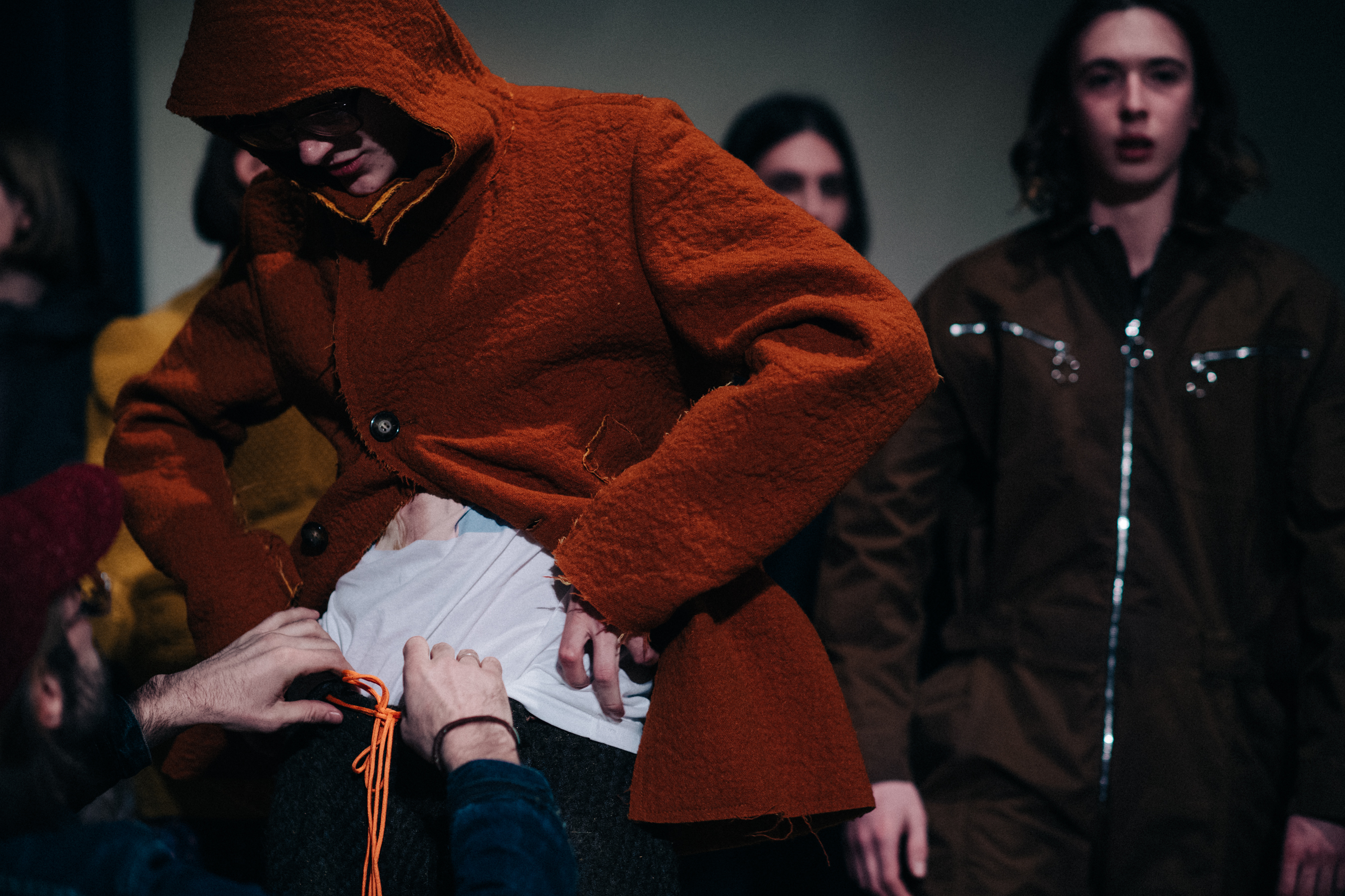 Male model wearing orange coat