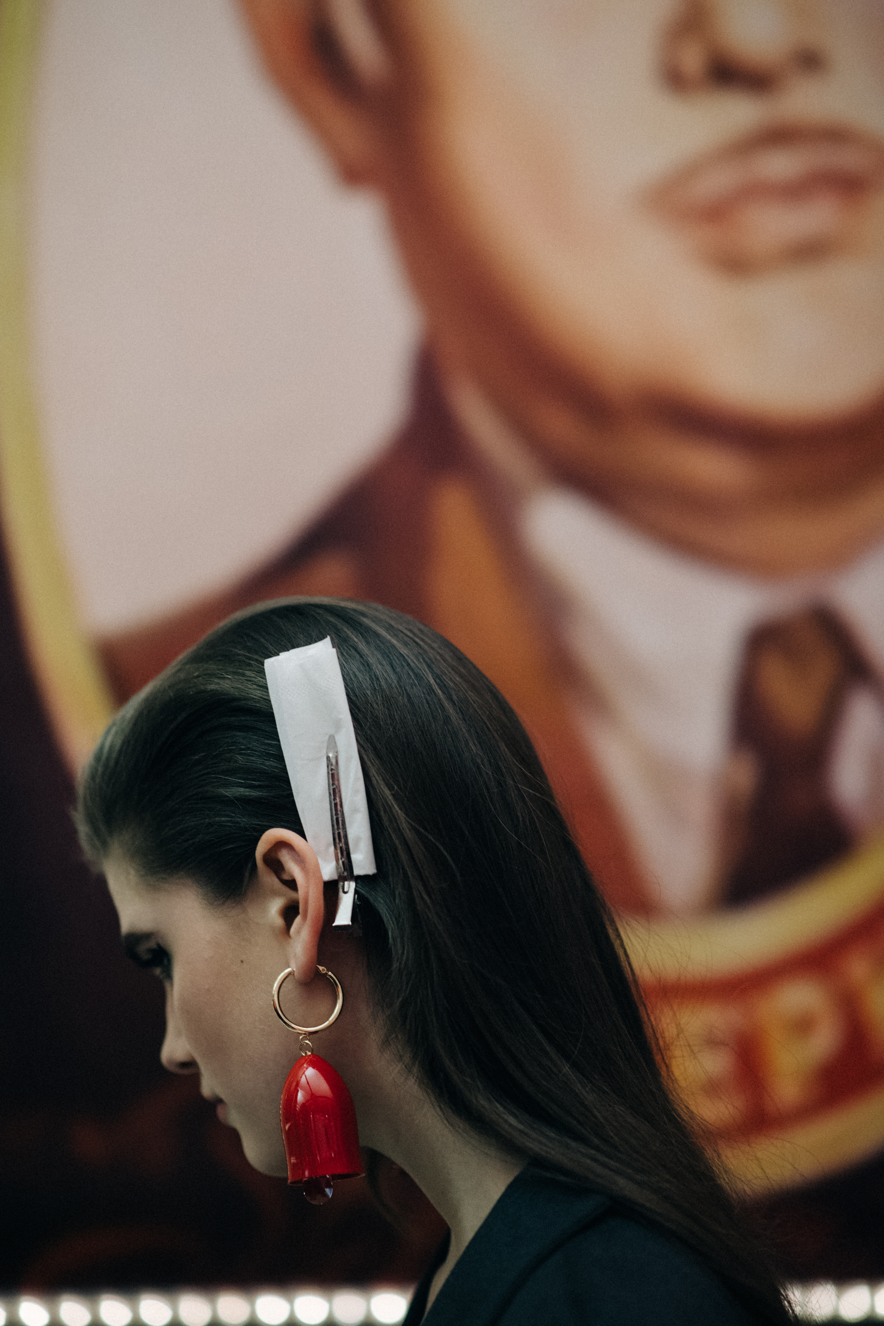 Model wearing red earring