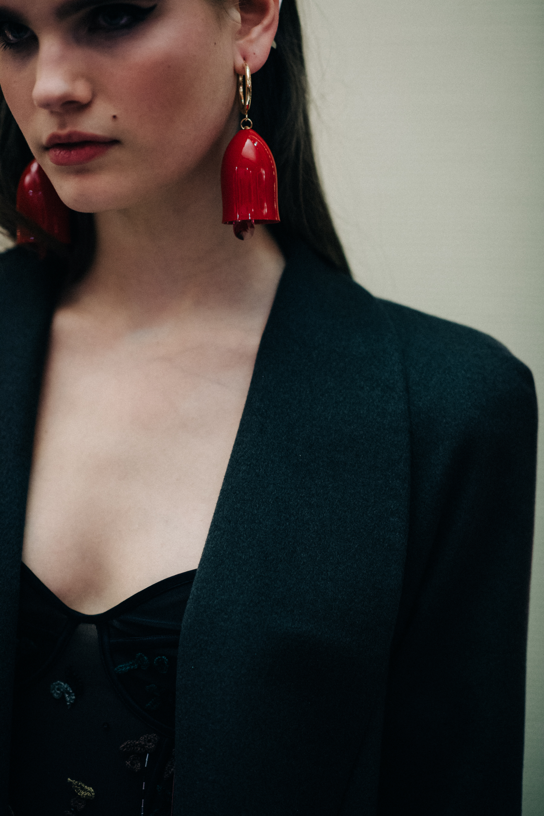 Model wearing red earring