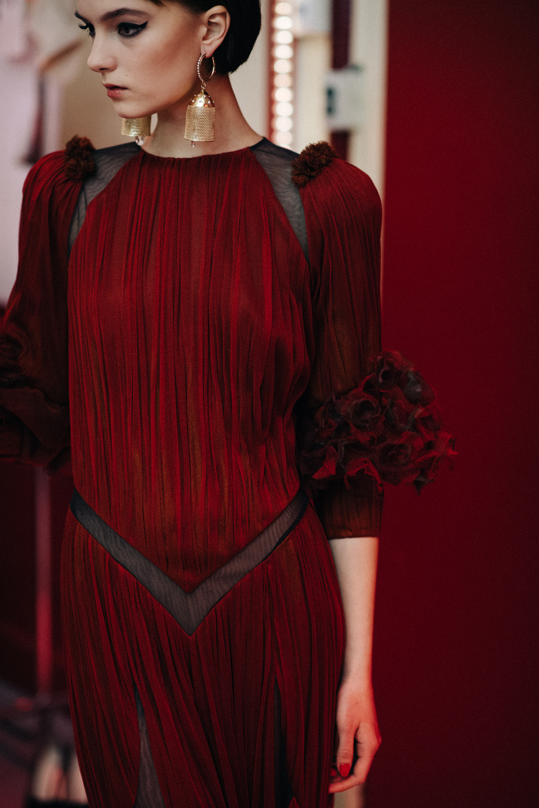 Model Irina Liss wearing red dress
