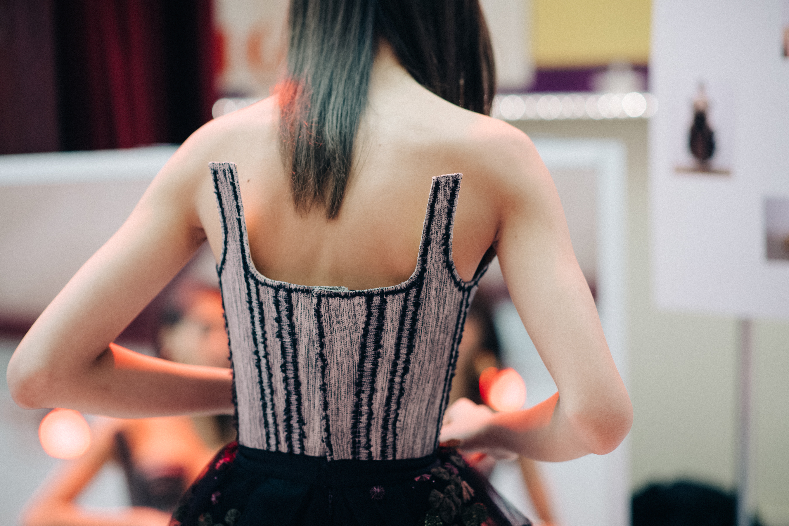Model wearing dress with corset