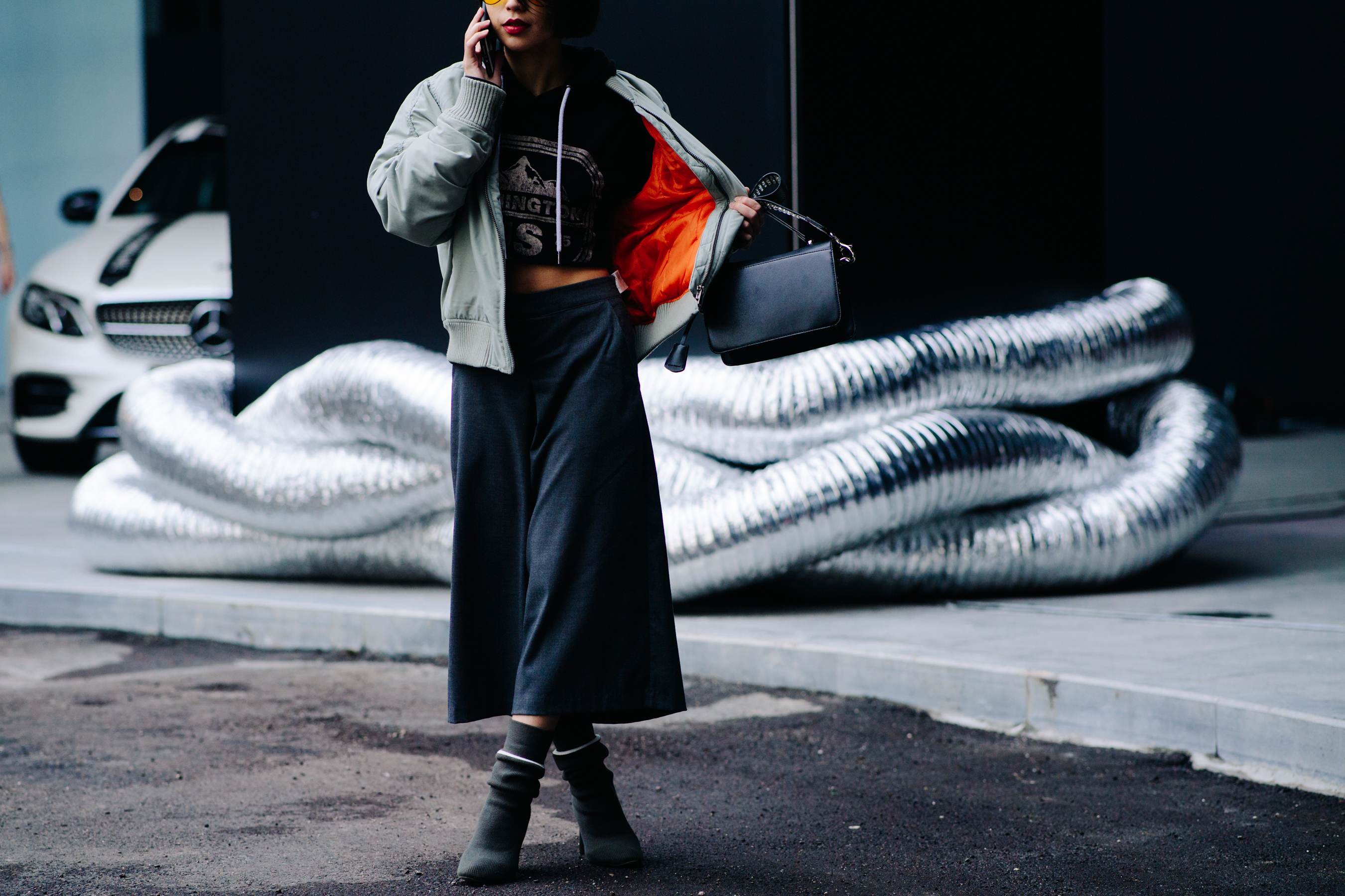 Woman wearing green bomber jacket