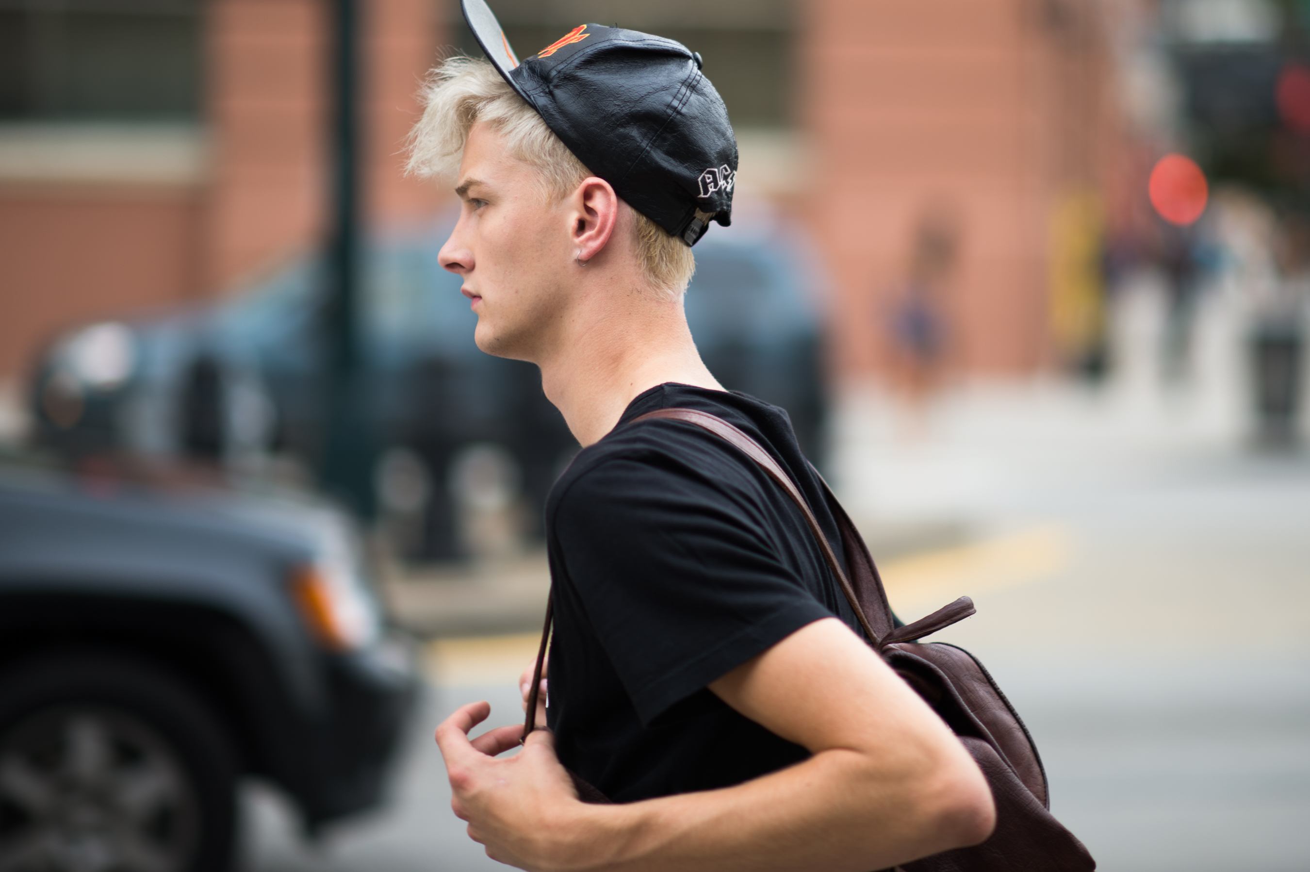 Male model wearing leather snapback
