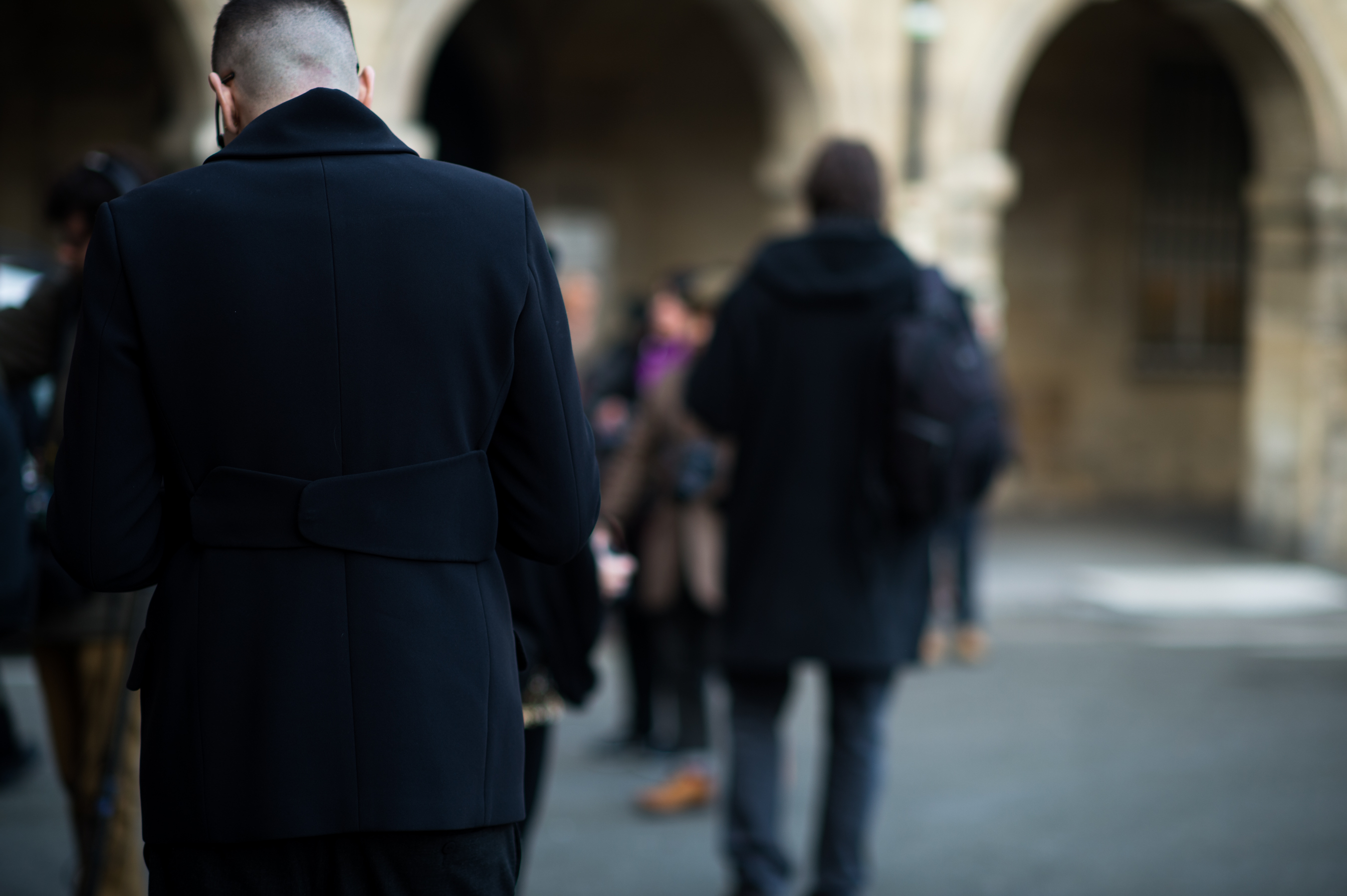 Man wearing black coat