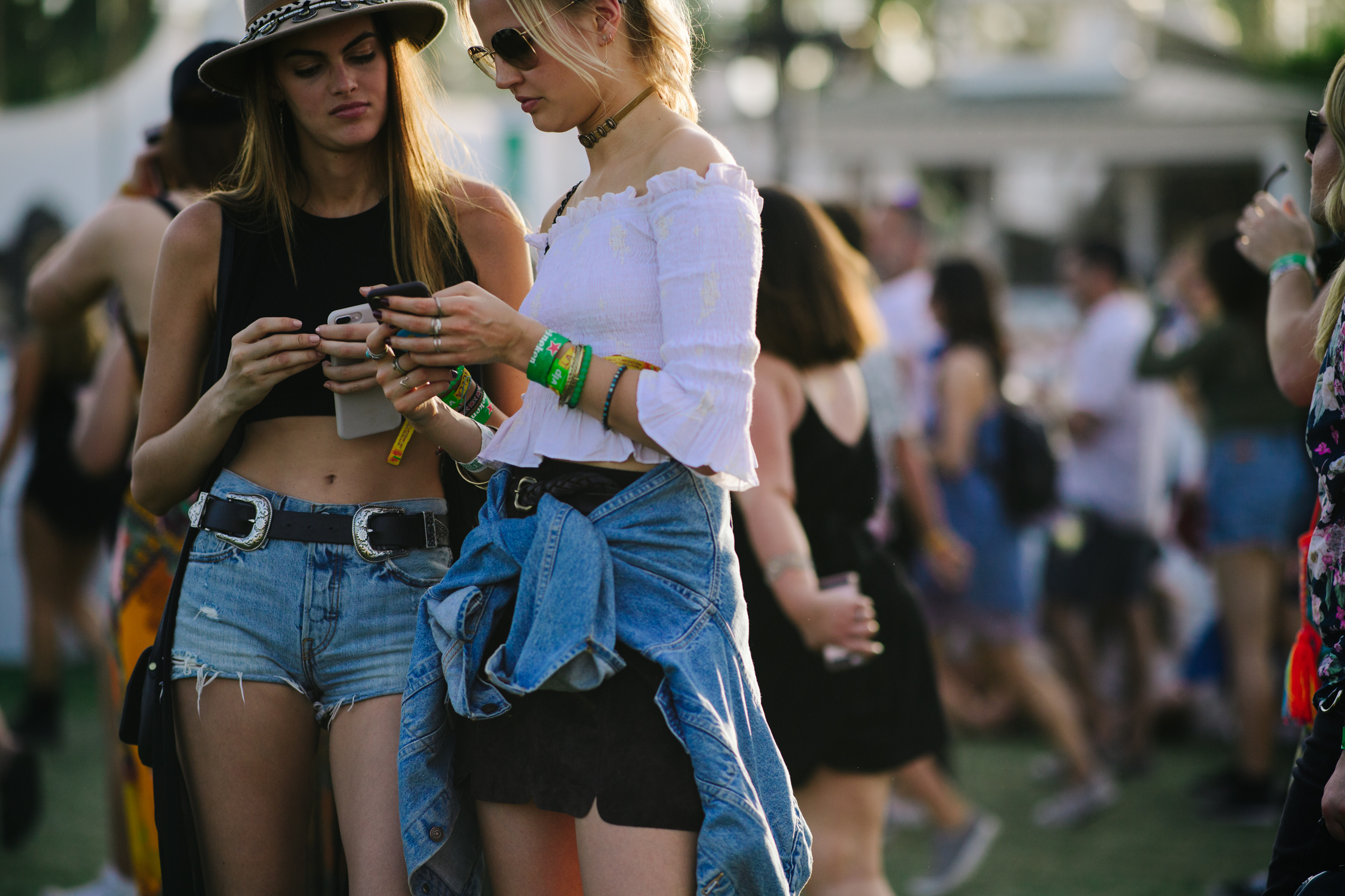 Two girls wearing denim shorts