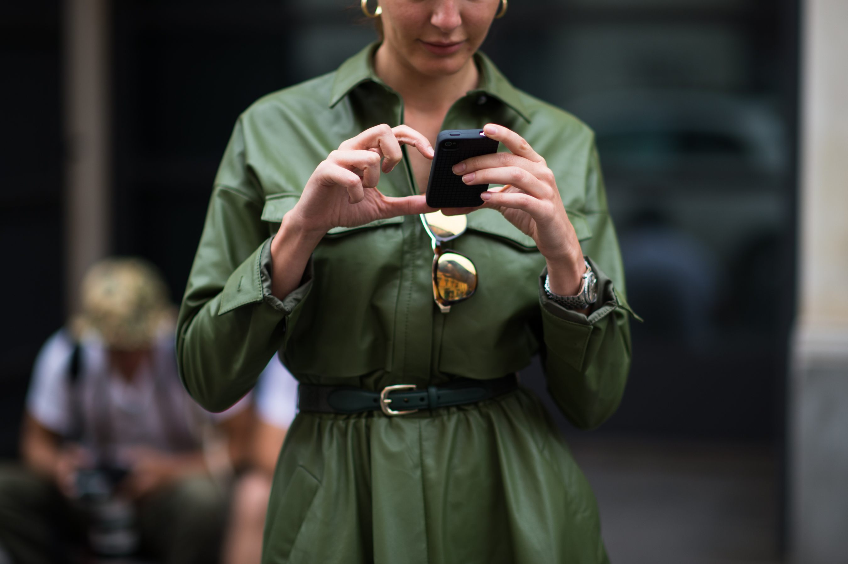 Stylist wearing green leather coat