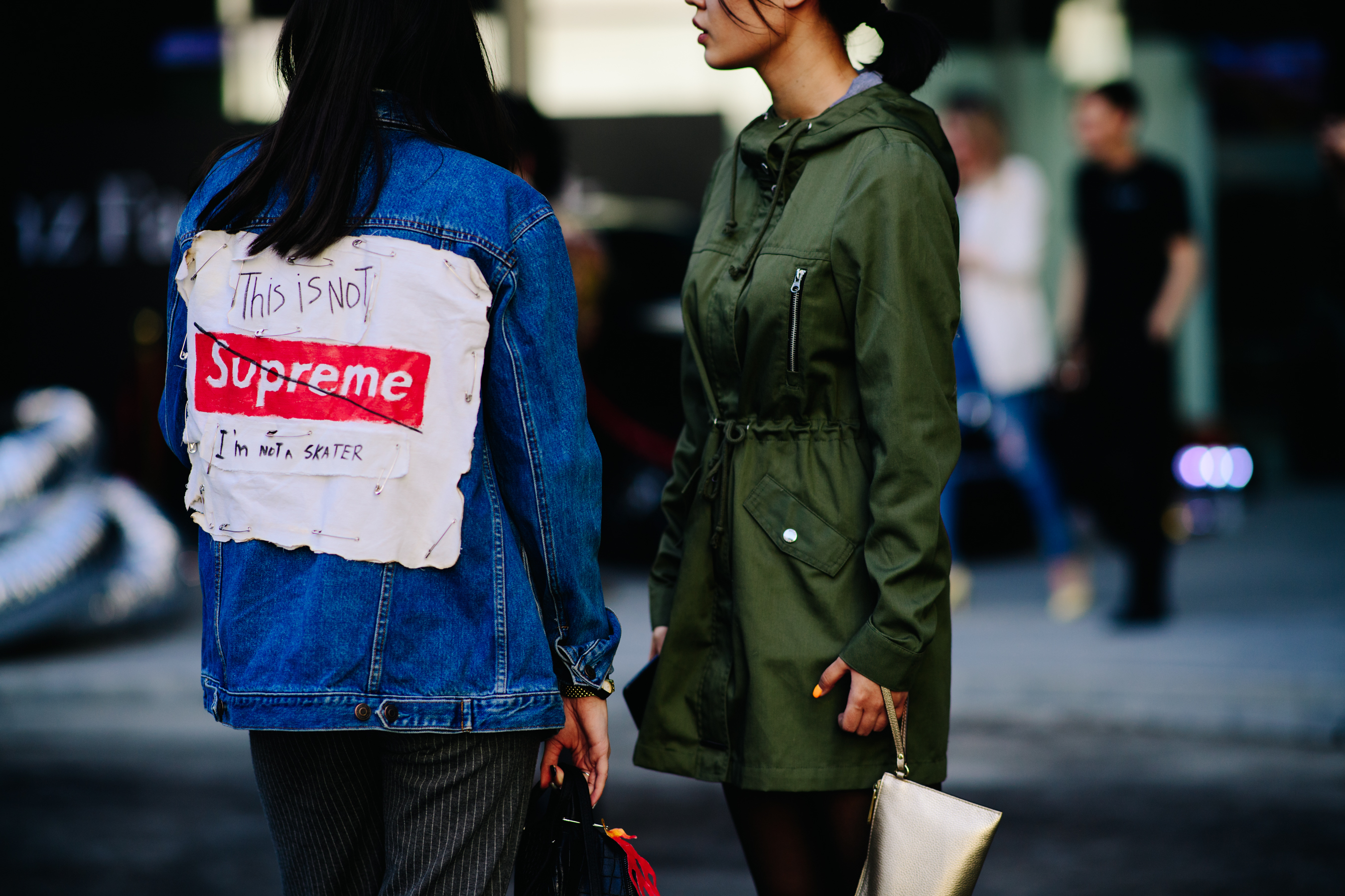 Girl wearing This is Not Supreme jacket