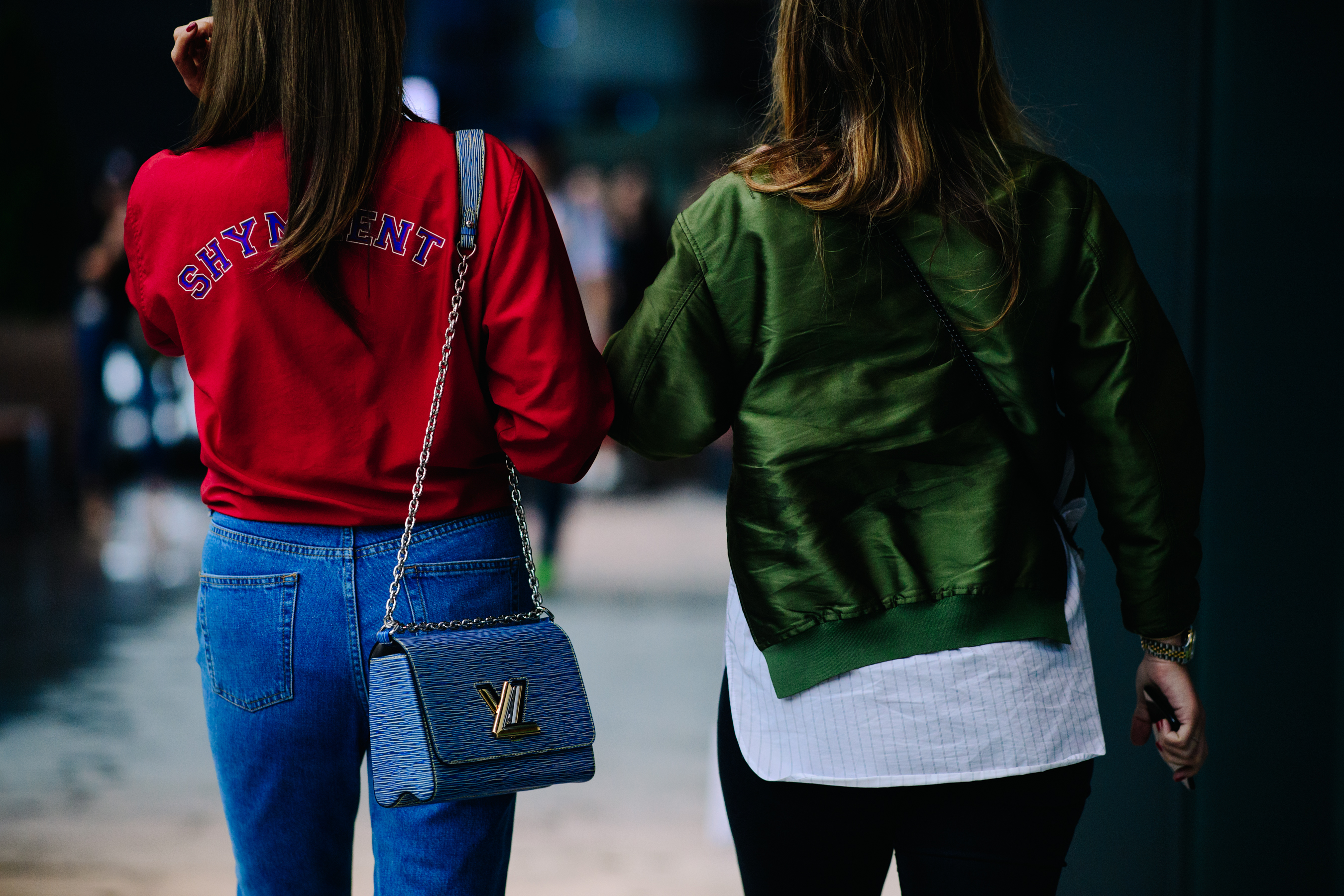 Two girls wearing green and red