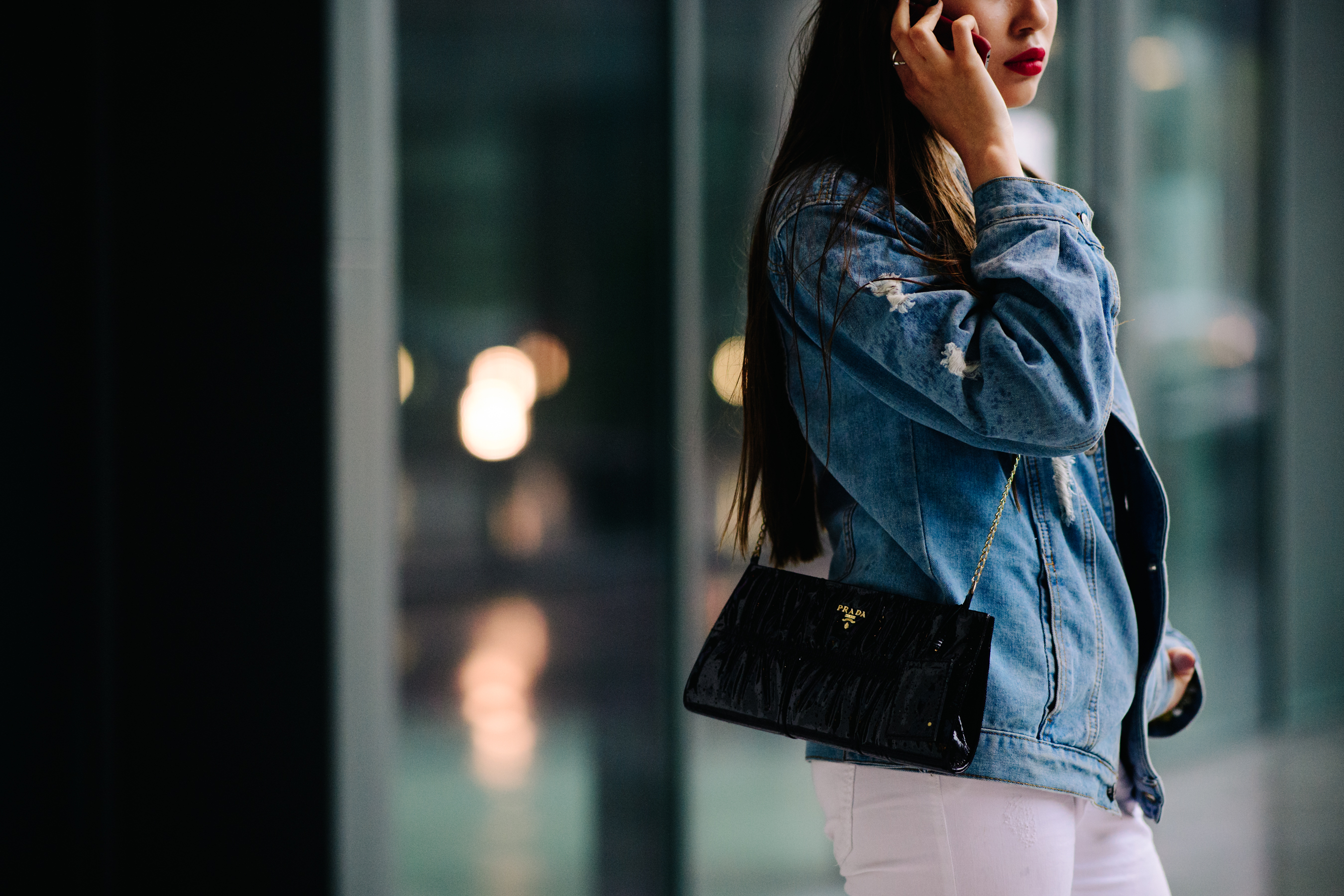Woman wearing Prada bag