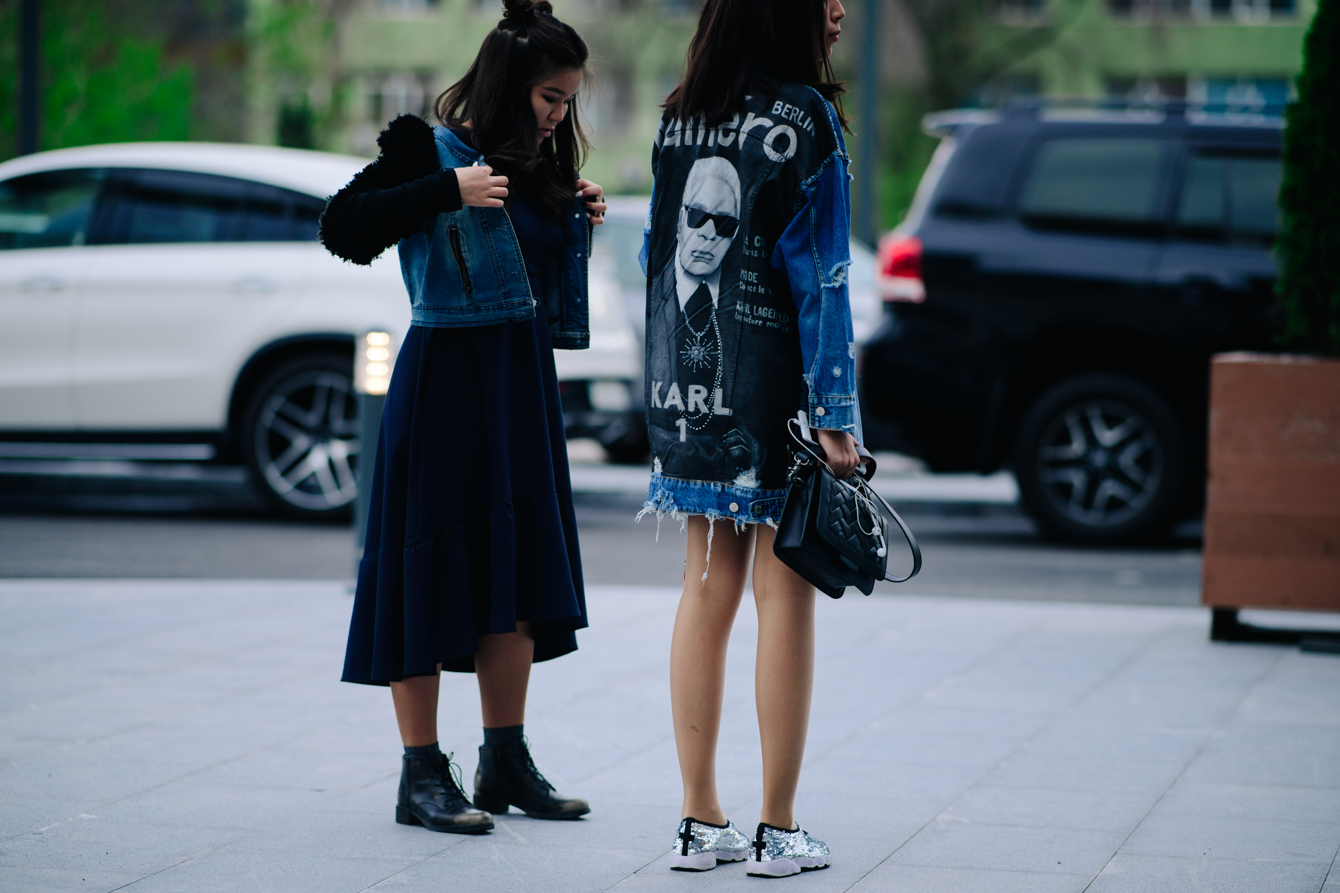 Two girls wearing denim jackets